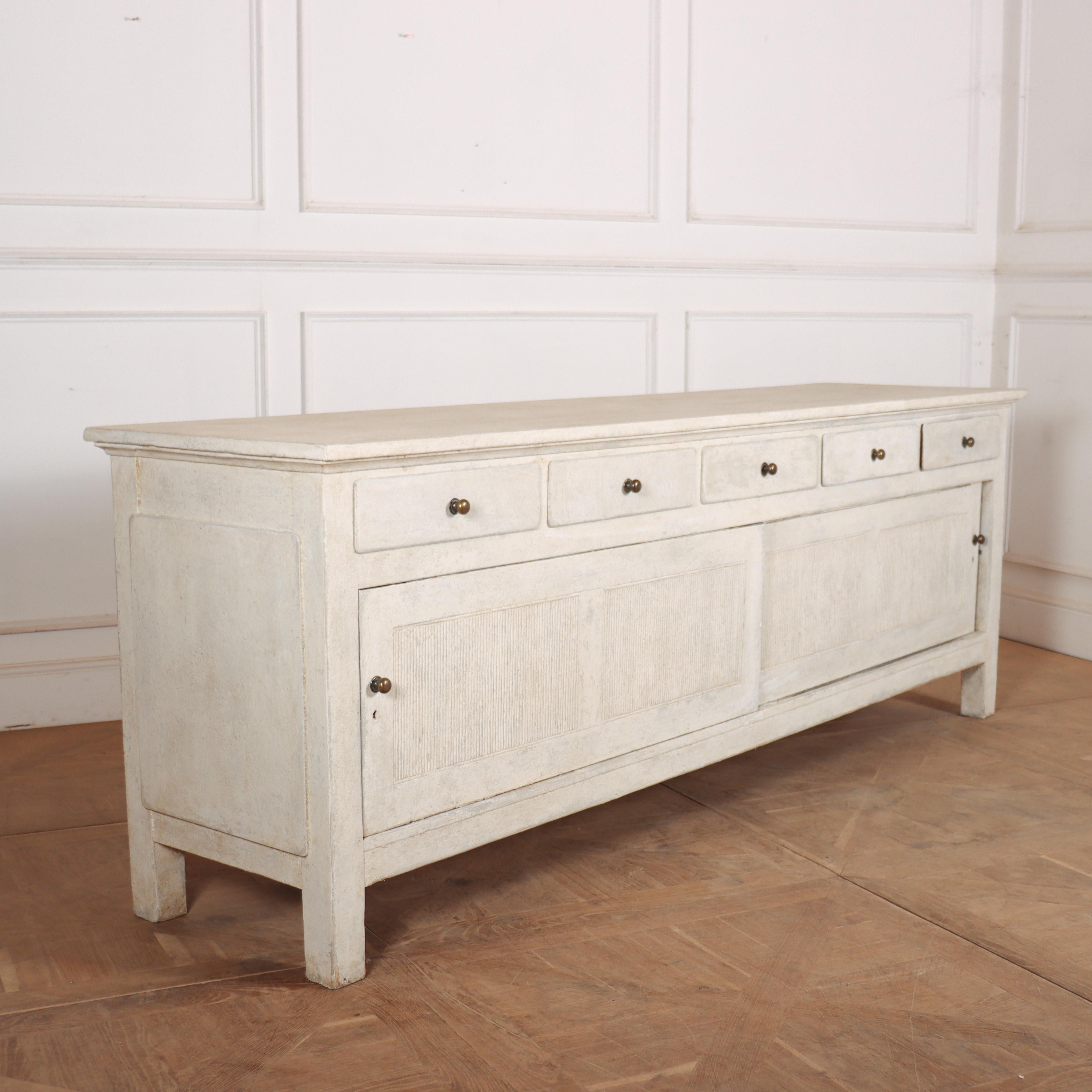 Large 19th C Swedish style painted pine dresser base with reeded doors. 1890.

Reference: 8370

Dimensions
95.5 inches (243 cms) Wide
24 inches (61 cms) Deep
34 inches (86 cms) High