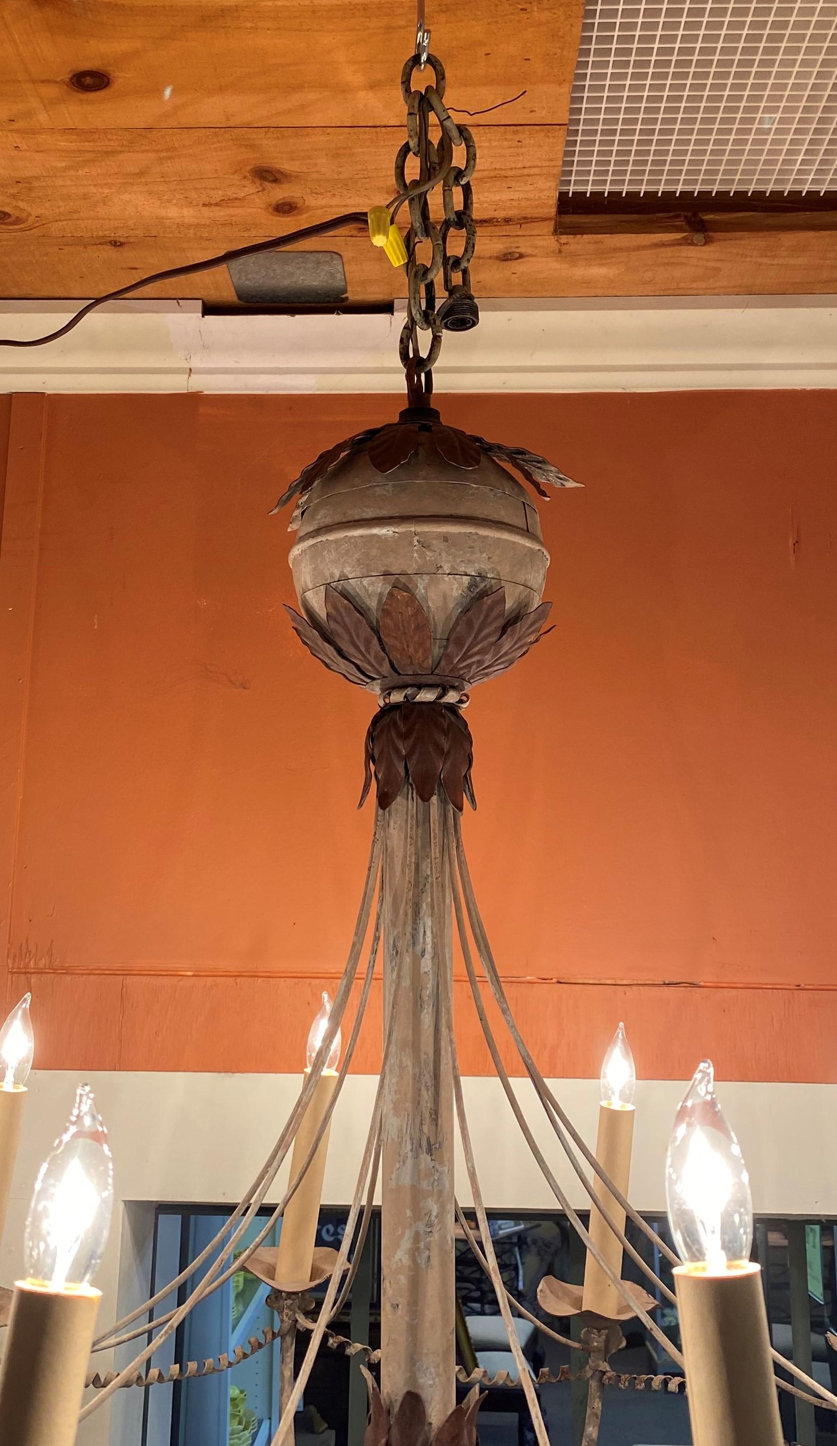 A great form Swedish style tole electrified 10 light chandelier with leaf decorated metal balls at the top and base, with curled metal swags running between the lights. Dates to the late 19th or early 20th century in working condition, with great