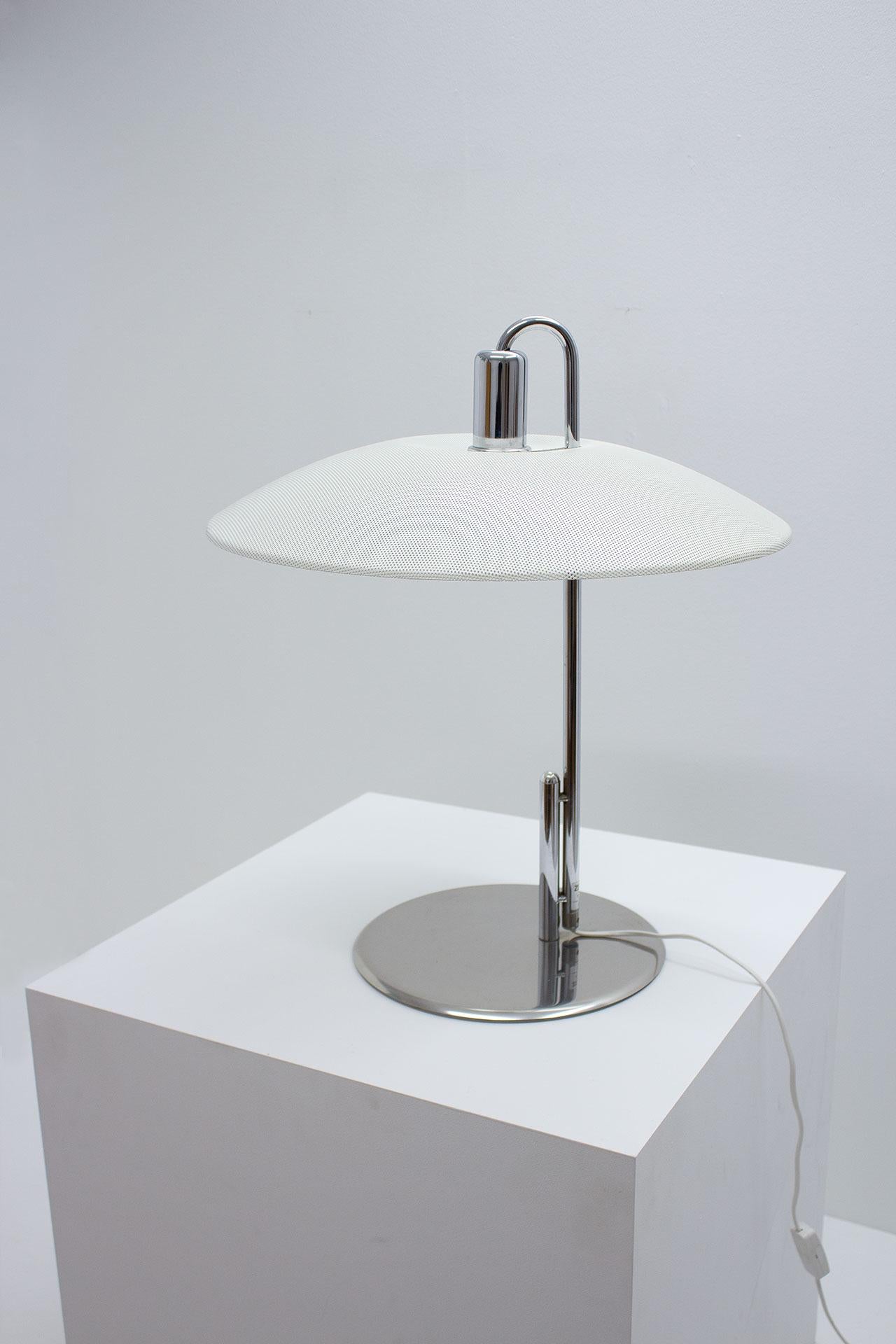Large and clean table lamp designed by Swedish duo Borge Lindau and Bo Lindekrantz during the 1970s. Manufactured in Sweden by ZERO. The lamp is made from chromed steel, cast iron base with a lacquered perforated metal shade. Great condition.