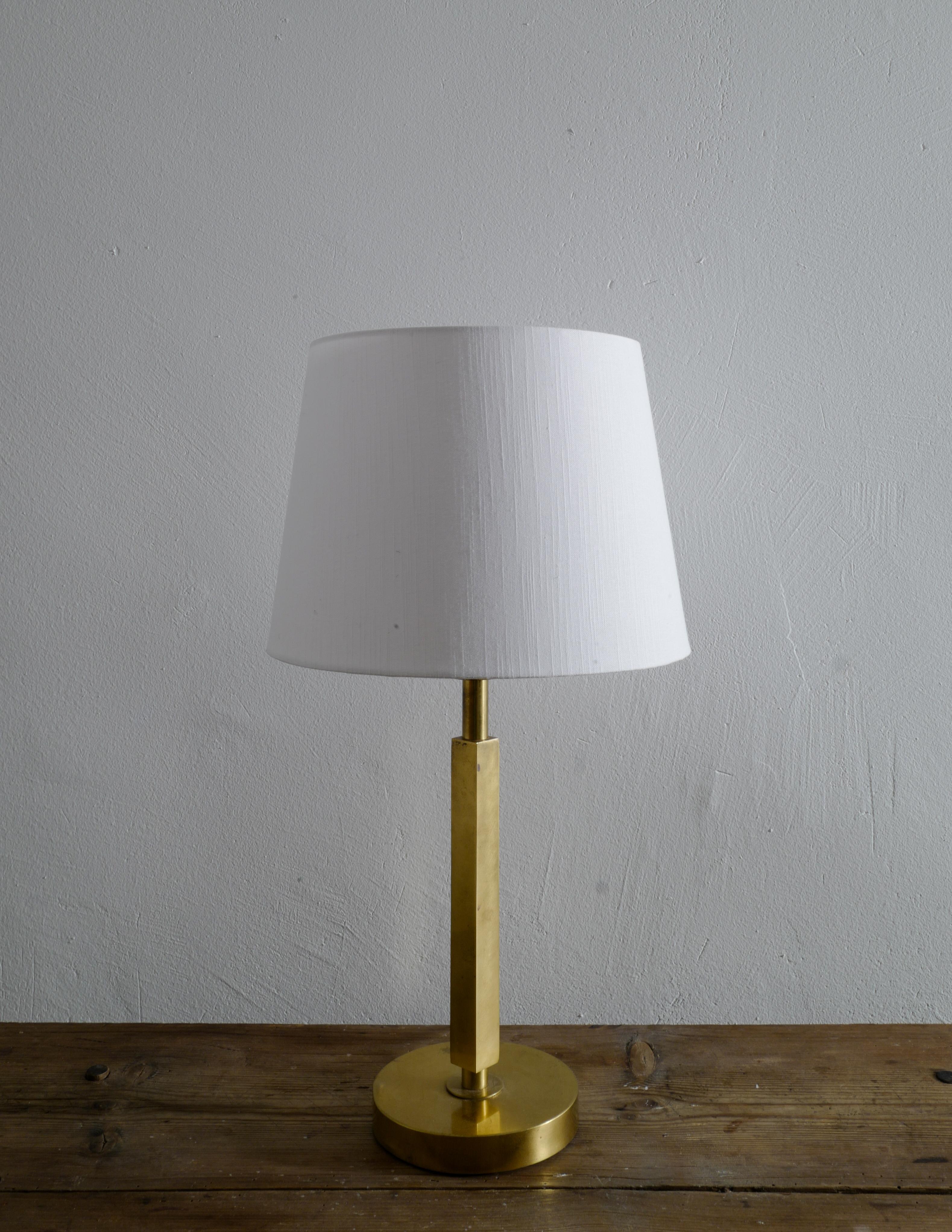 Rare table lamp in brass produced in Sweden in the 1960s. 
In good vintage condition with some signs from use. Original sticker on the bottom of the foot. 

Measurements are taken without the shade and the shade is excluded from the purchase.