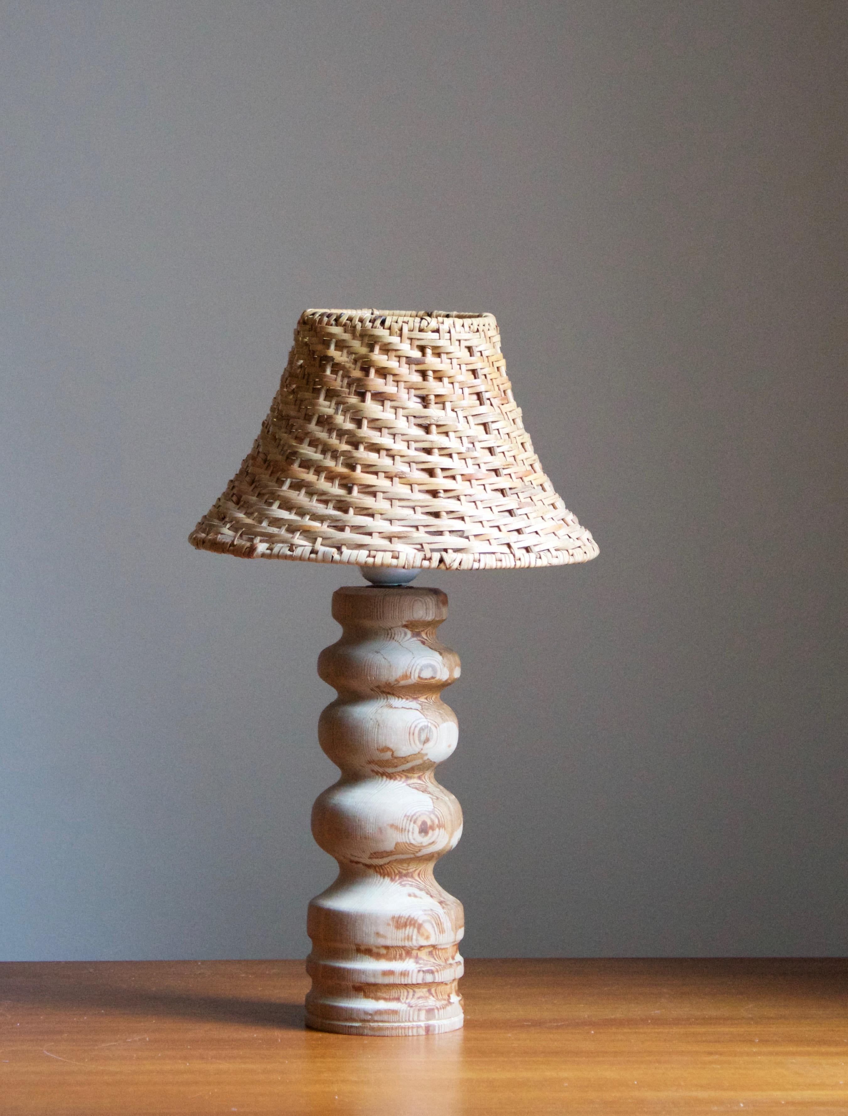 A table lamp designed and produced in Sweden, 1970s. 

Stated dimensions exclude lampshades, height includes socket. Upon request illustrated model rattan lampshades can be included in purchase.