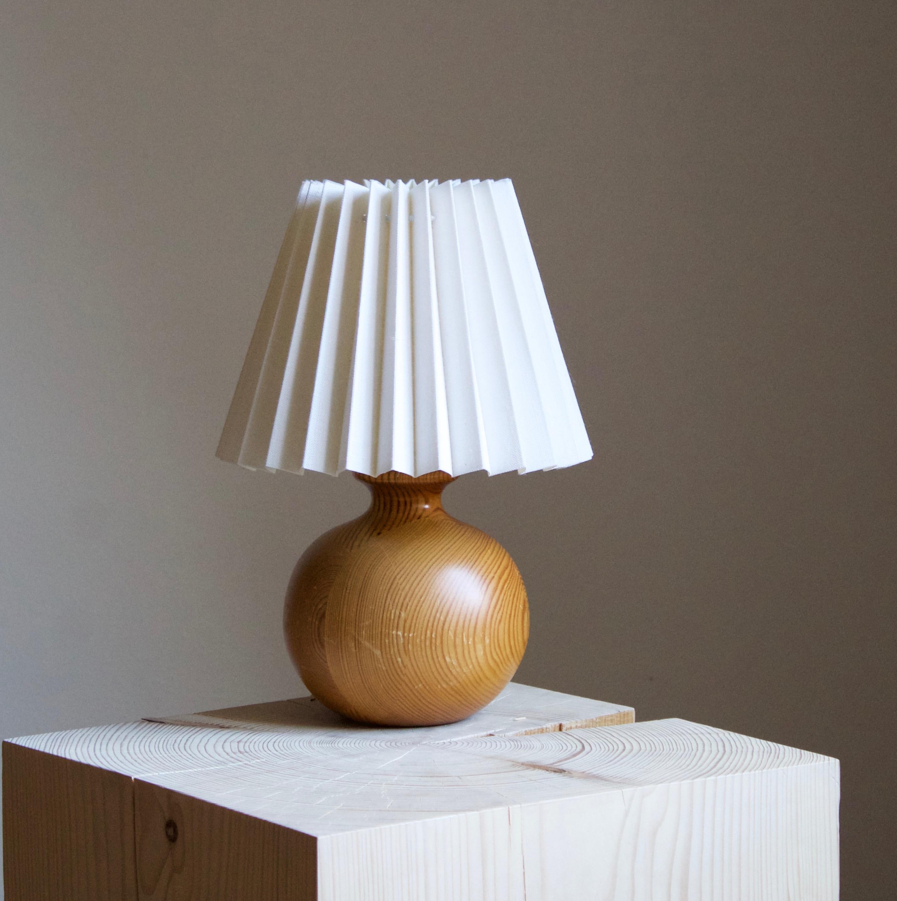 A table lamp, in pine. Produced in Sweden c. 1970s.

 Sold without lampshade, stated dimensions exclude lampshade, height includes socket.