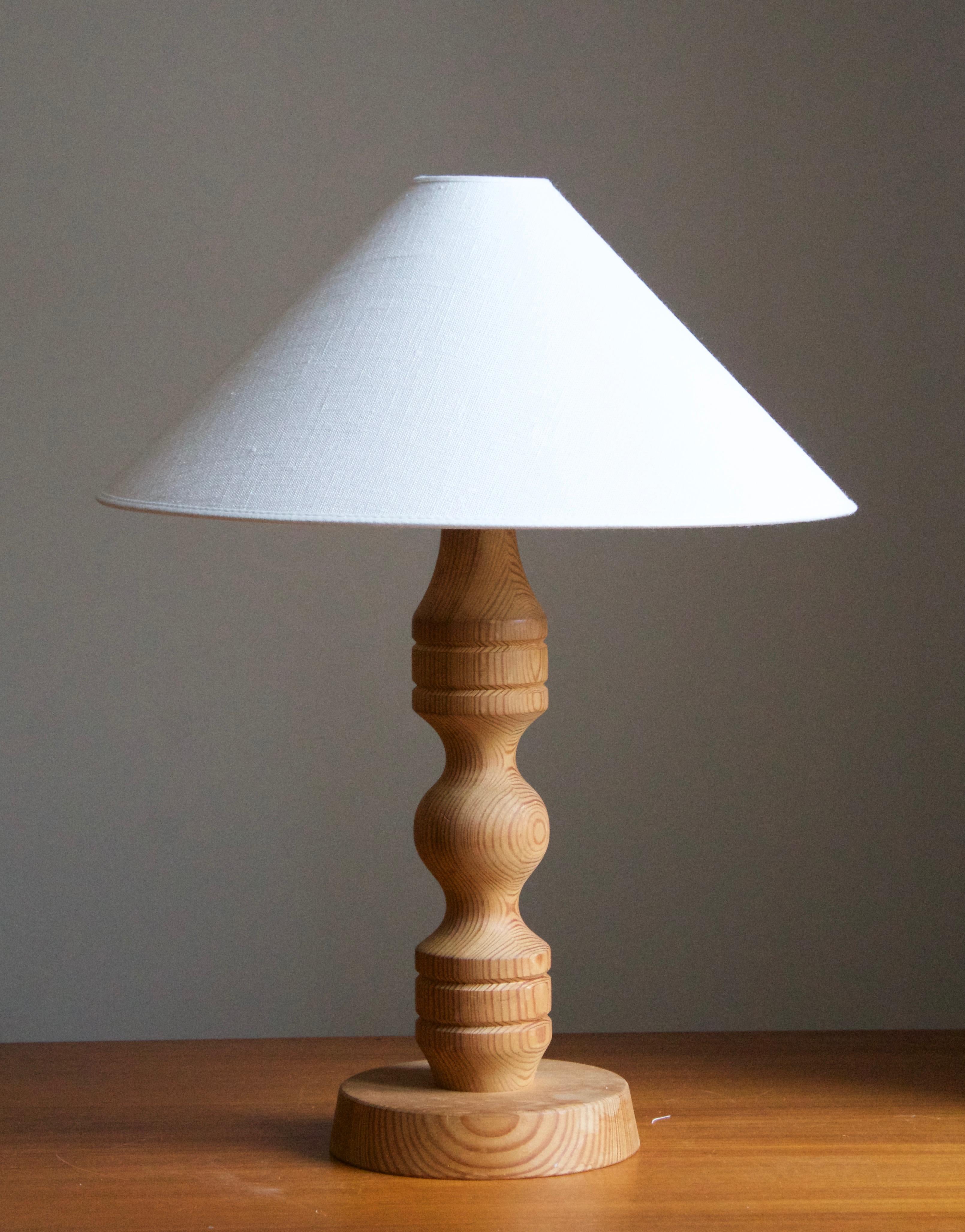 A table lamp, in pine. Produced in Sweden c. 1970s.

Sold without lampshade, stated dimensions exclude lampshade, height includes socket.