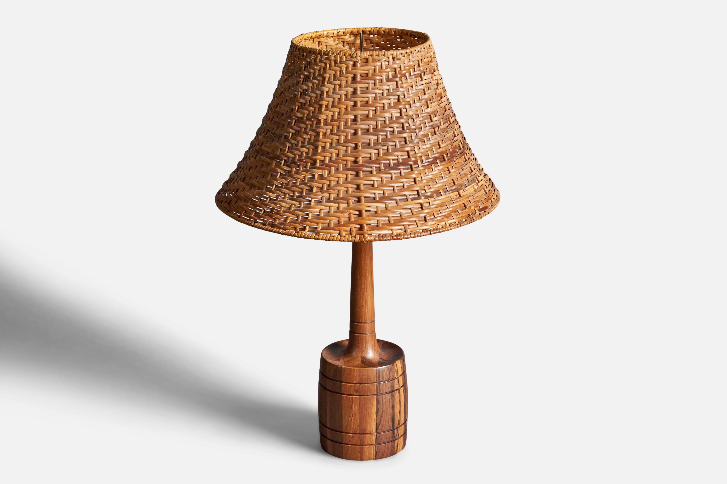 A table lamp. In solid rosewood with carved details. 

Stated dimensions exclude lampshade. Upon request illustrated lampshade can be included in purchase.