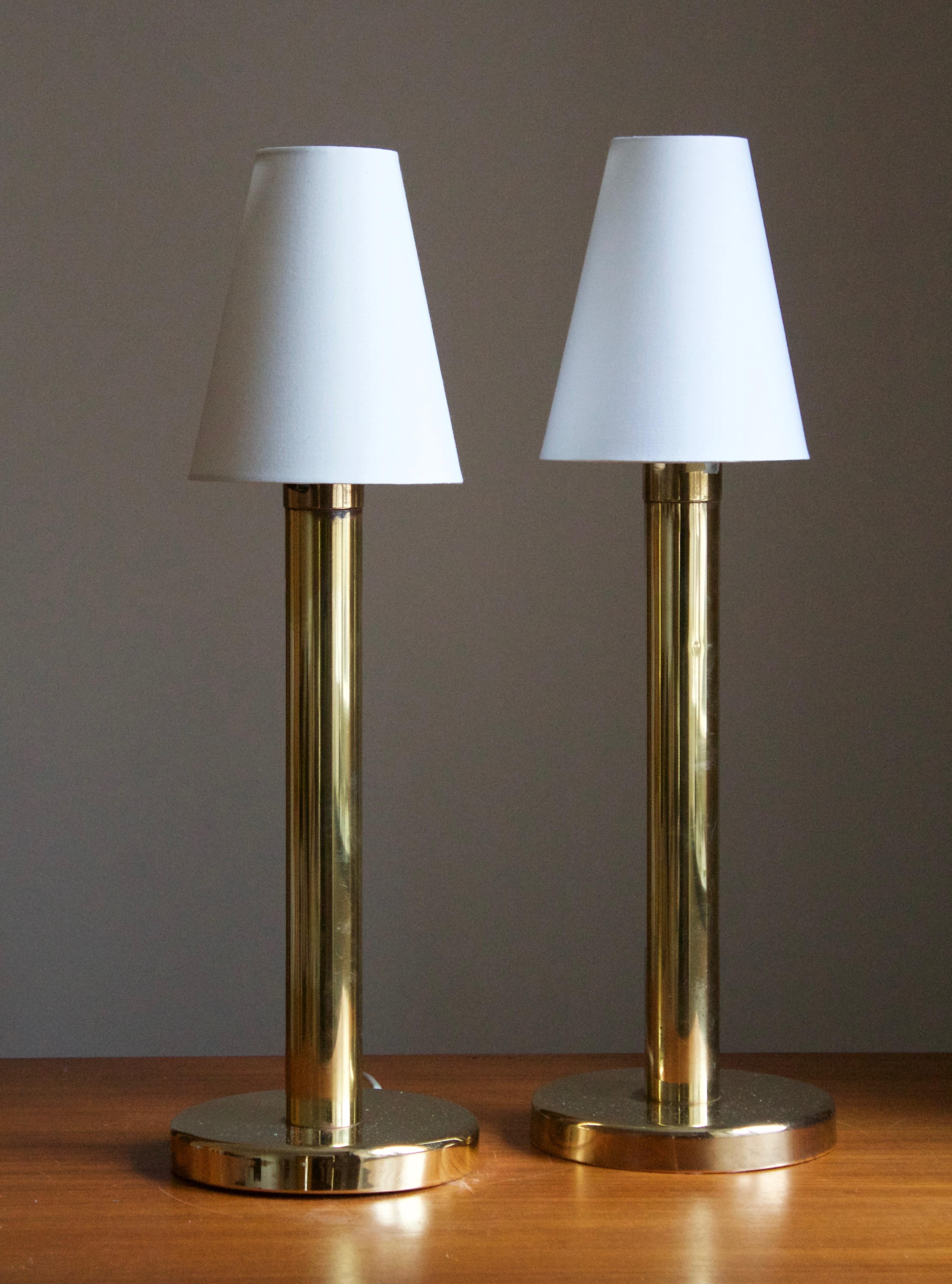 A pair of table lamps, designed and produced in Sweden, circa 1970s. Brand new lampshades.

Stated dimensions include lampshade.