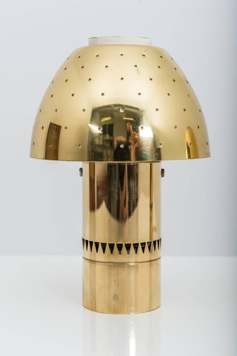 Pair of small Swedish table lamps in perforated brass by Hans-Agne Jakobsson for Markaryd from the Scandinavian Mid-Century Modern era. The lamps give a cozy, ambient light when lit.
Condition: They are in excellent vintage condition with only
