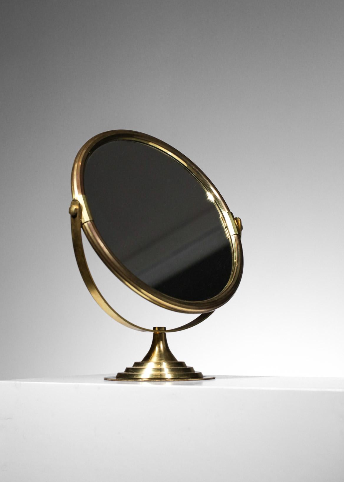 Swedish table mirror from the 60's. Solid brass structure, possibility to rotate it with a mirror on both sides. Sober and clean design typical of Scandinavian work from this era. Excellent vintage condition, slight traces of time and use (see