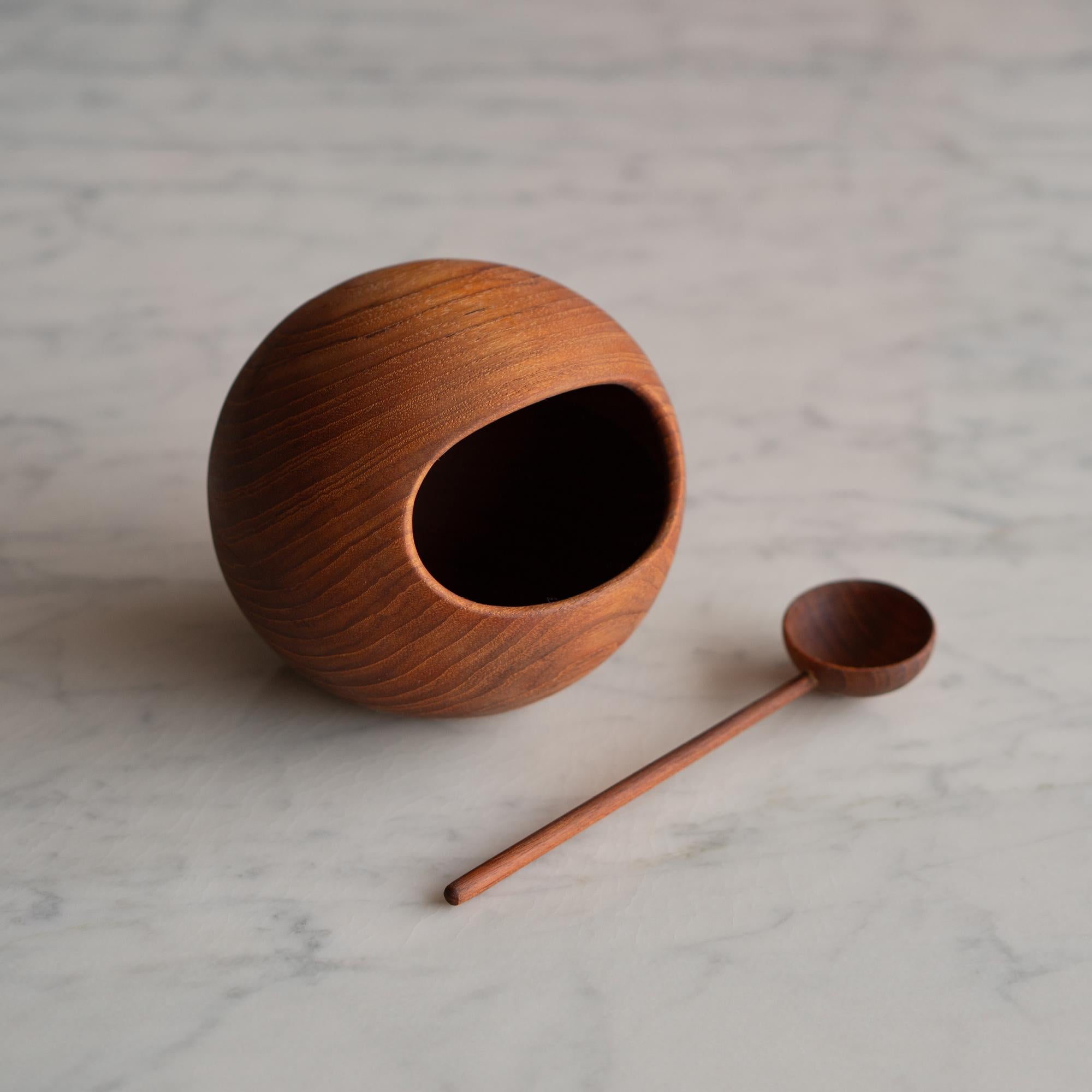 The enduring appeal of Scandinavian design continues to resonate, with both vintage and contemporary pieces captivating collectors worldwide. This teak nut bowl and spoon by Sowe Konst of Sovestad, Sweden exemplifies that sensibility. Known for