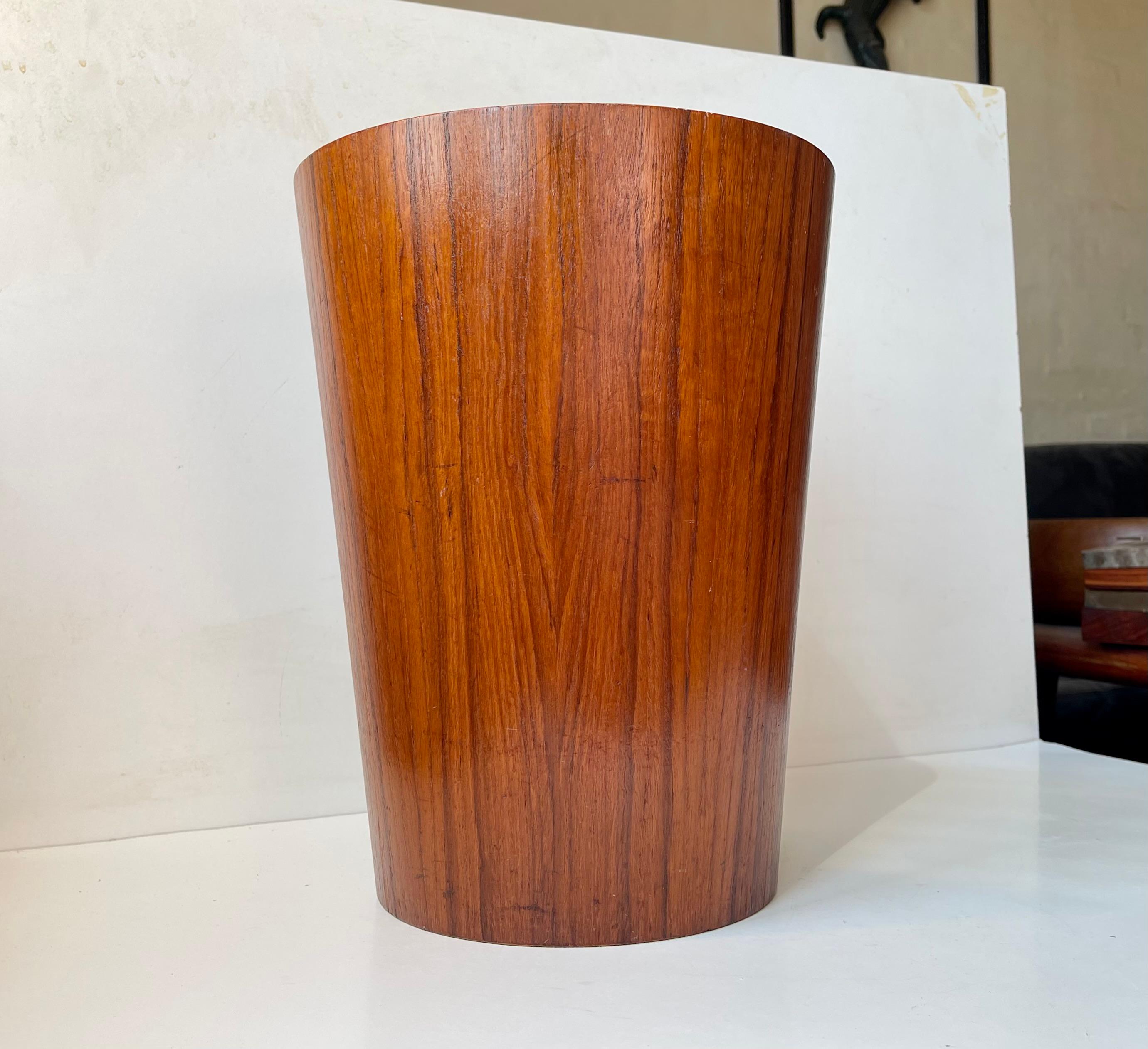 
Mid-Century Modern circular teak waste basket designed by Martin Åberg for the Swedish company Servex in 1955. It features birch interior and original makers mark and design number stamped underneath the base. The teak has a beautiful grain and