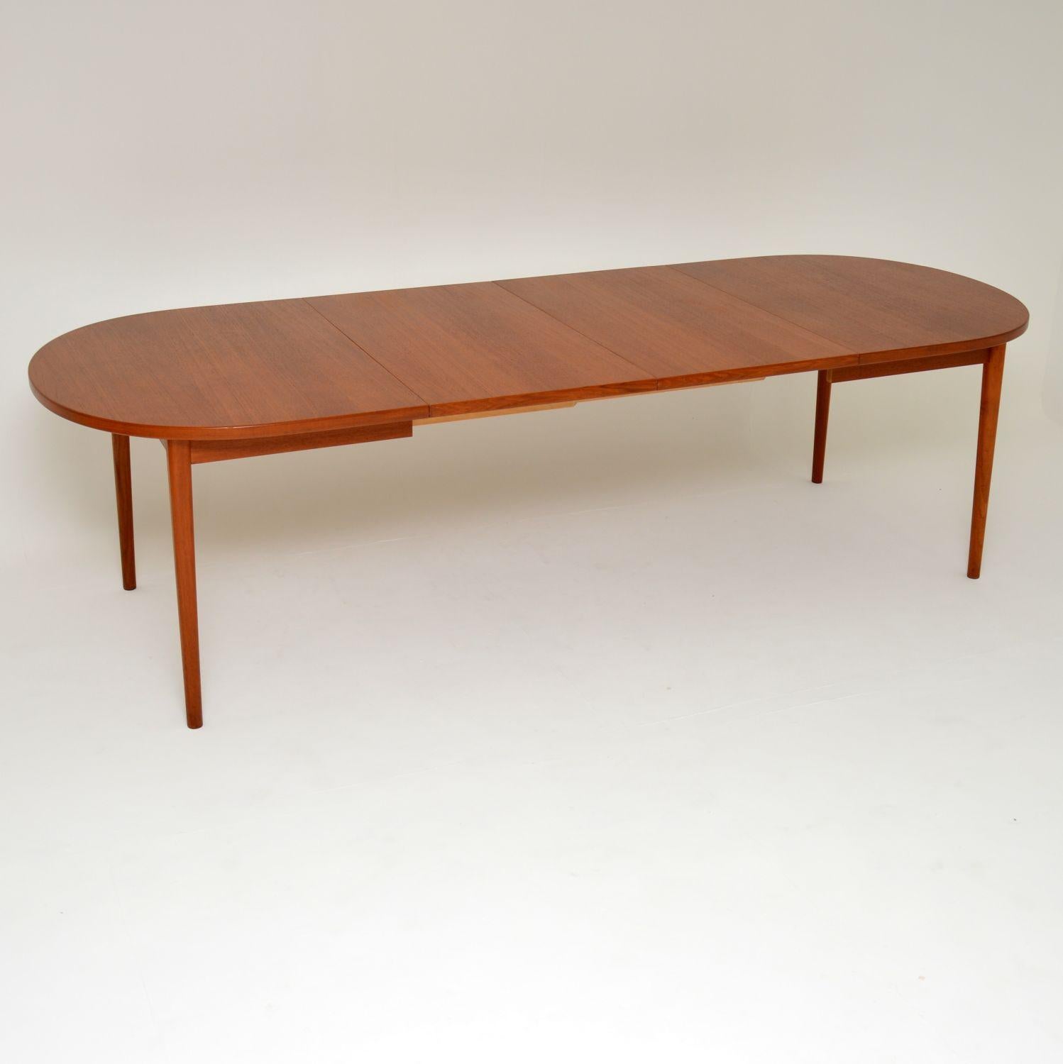 A top quality, stylish and very large vintage teak dining table. This was made in Sweden by Troeds and was designed by Nils Jonsson. It dates from the 1960s-1970s, and is in superb condition for its age. The top is beautiful and clean with barely a