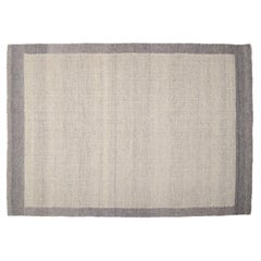 Swedish textile designer. Hand-knotted wool rug.  Woven in gray and white colors