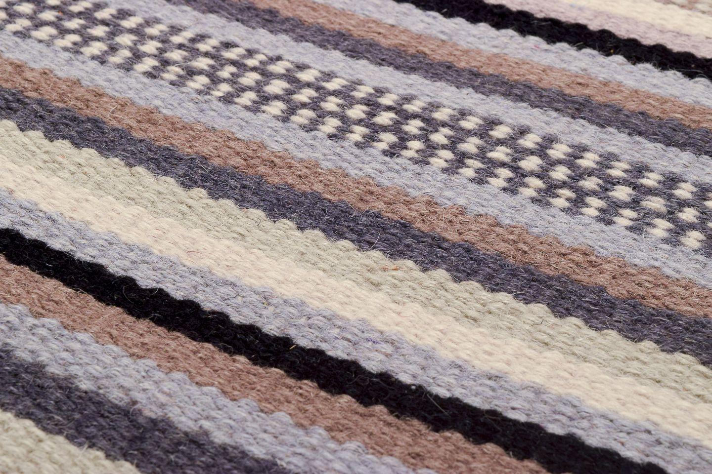 Swedish textile designer. Hand-knotted wool rug.  Woven in several colors. In Excellent Condition For Sale In Copenhagen, DK