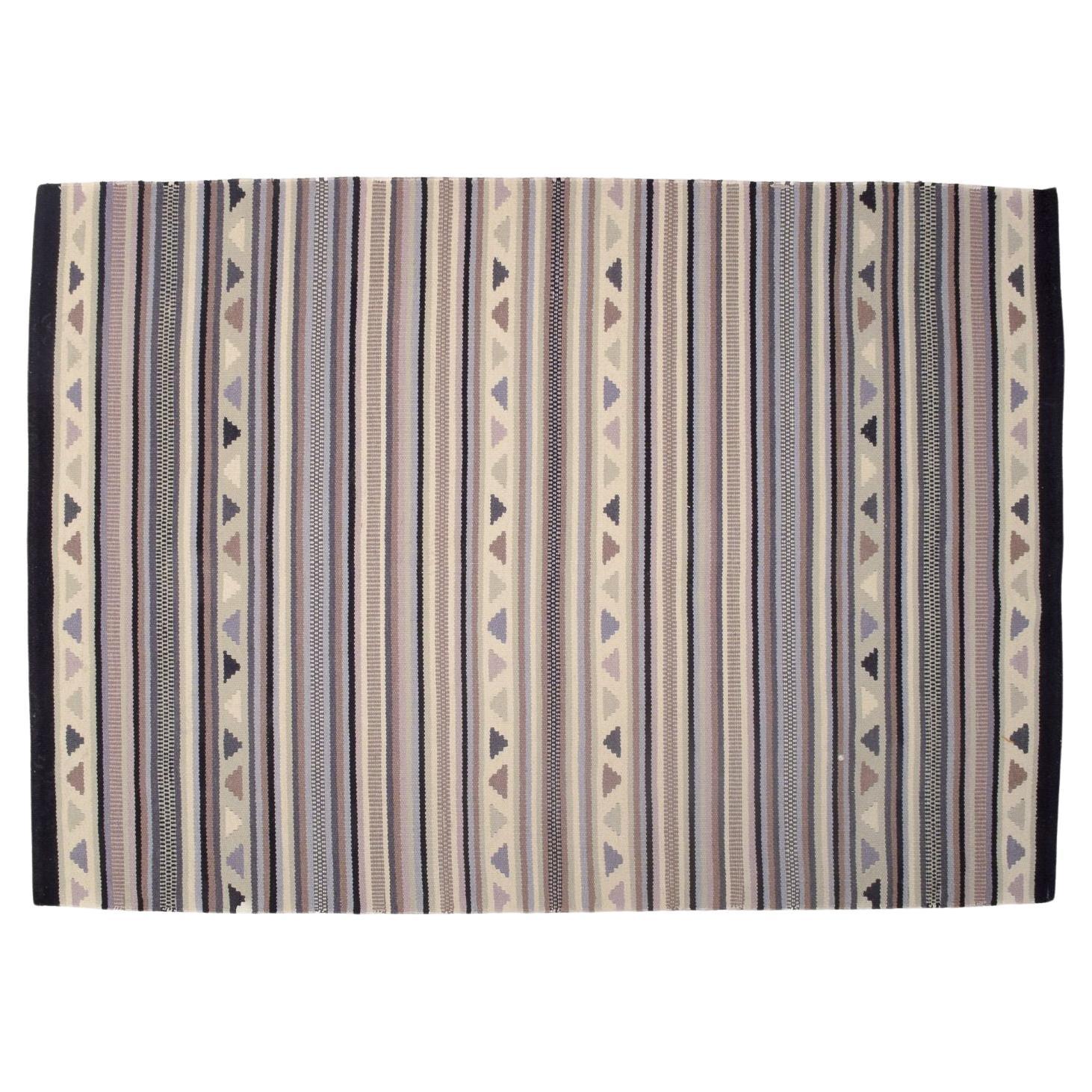 Swedish textile designer. Hand-knotted wool rug.  Woven in several colors. For Sale