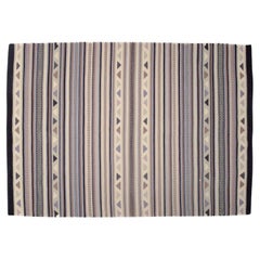 Swedish textile designer. Hand-knotted wool rug.  Woven in several colors.
