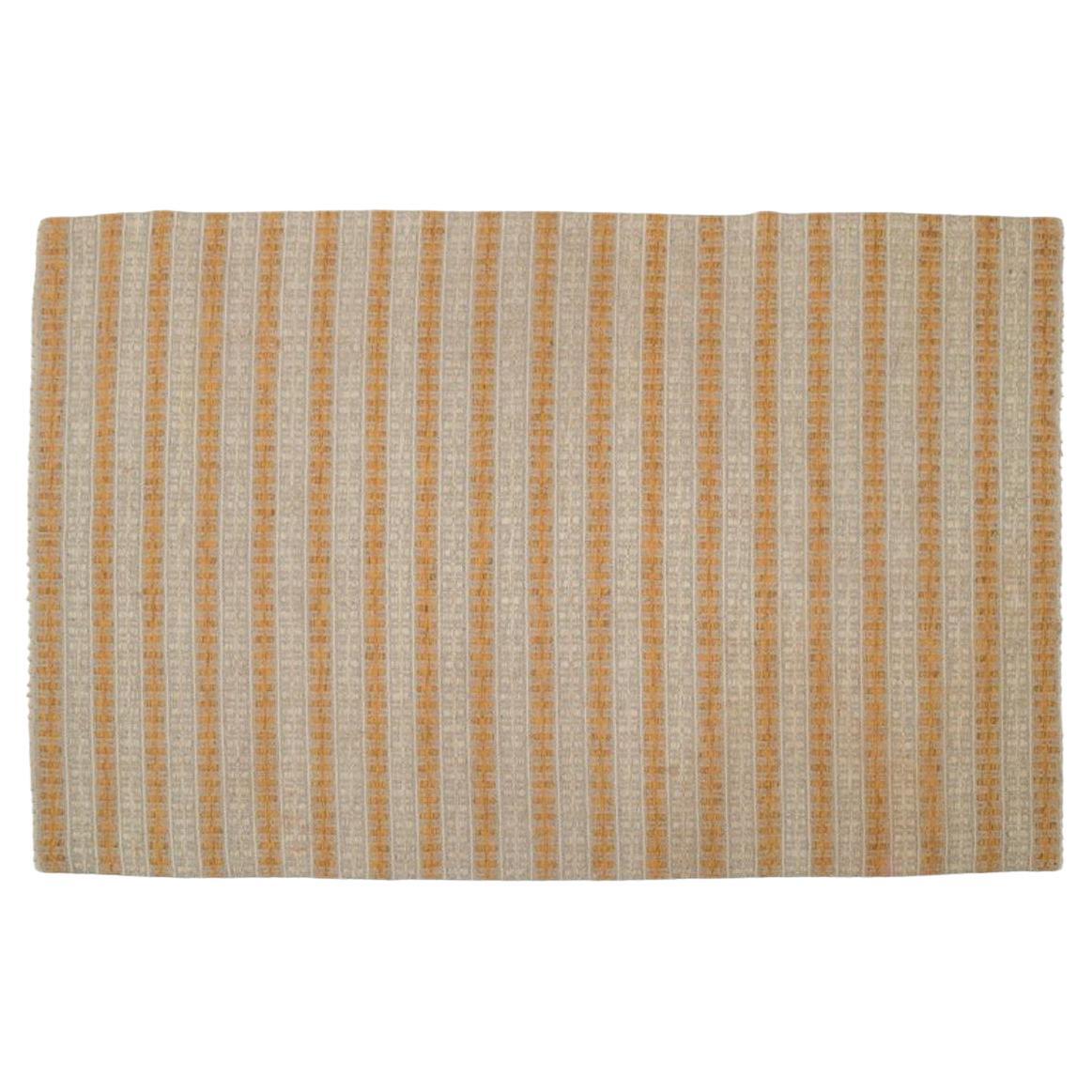 Swedish textile designer. Handwoven carpet in pure wool. Geometric fields.