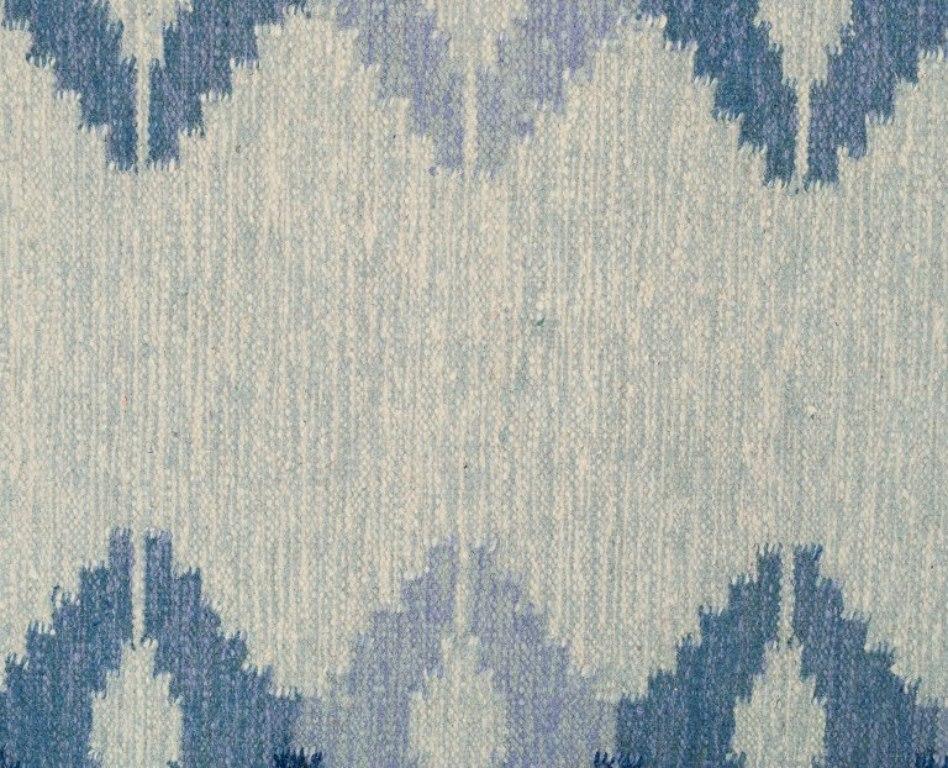 Scandinavian Modern Swedish textile designer. Handwoven carpet in pure wool. Gray and blue colors.