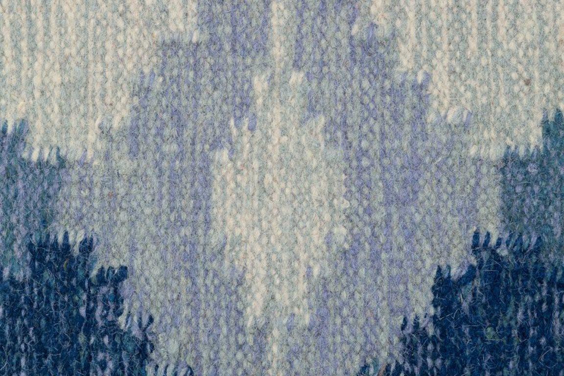 Swedish textile designer. Handwoven carpet in pure wool. Gray and blue colors. In Excellent Condition In Copenhagen, DK