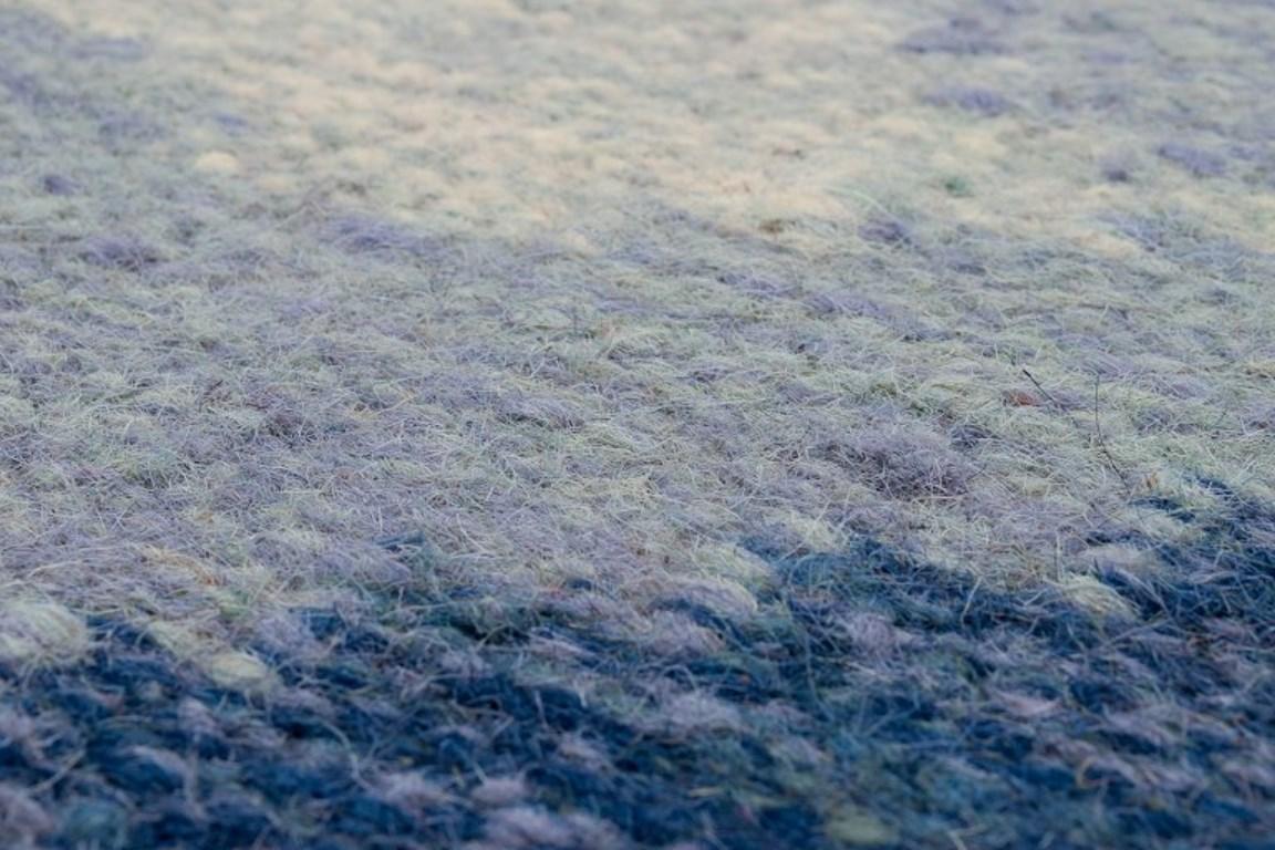 20th Century Swedish textile designer. Handwoven carpet in pure wool. Gray and blue colors.