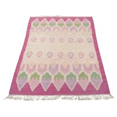Swedish textile designer. Handwoven carpet in pure wool. Pink and blue colors.