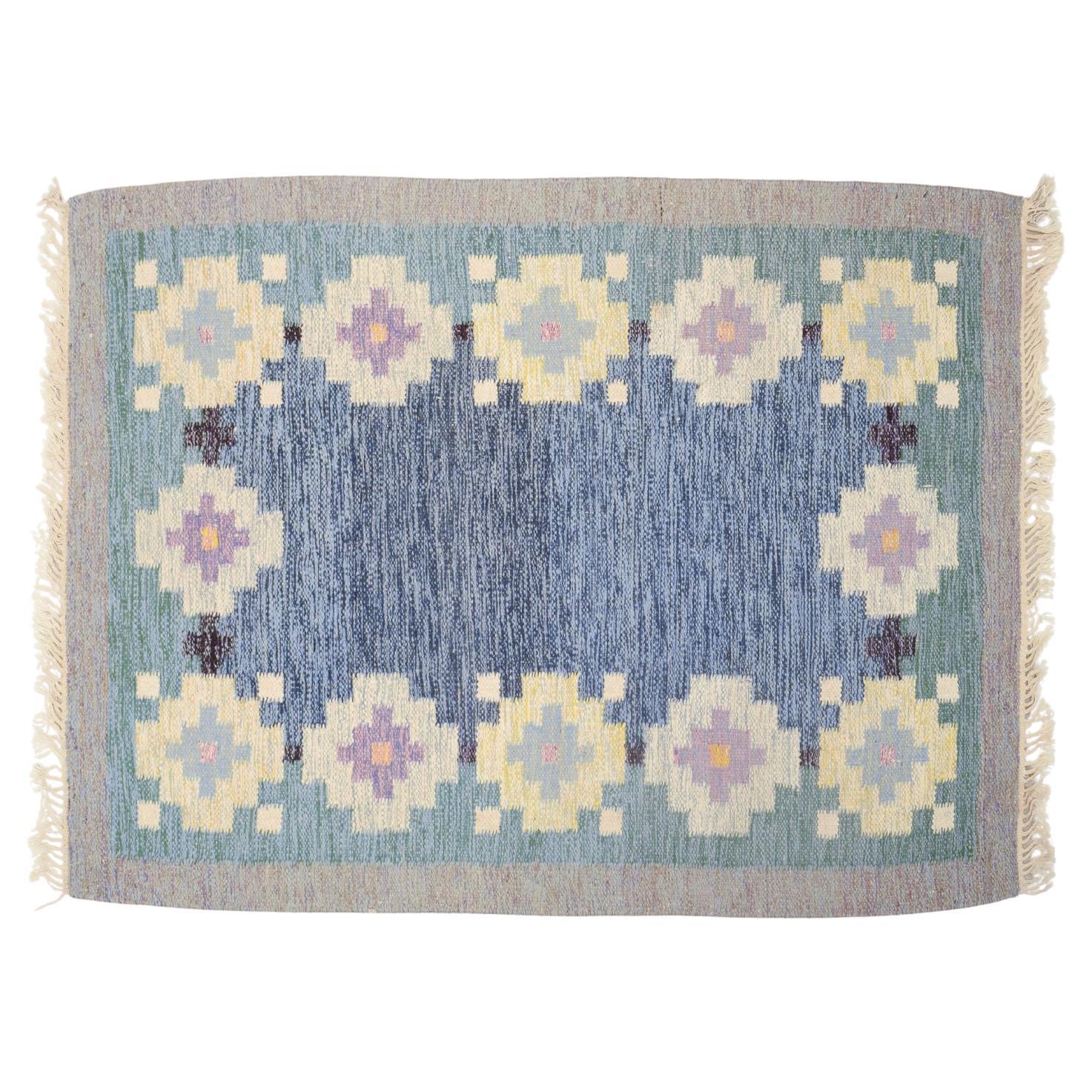 Swedish textile designer. Handwoven rug made of wool. Rölakan technique.