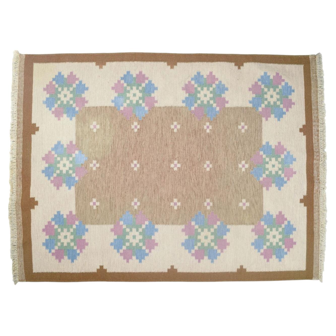 Swedish textile designer. Handwoven Rölakan wool rug with geometric pattern.