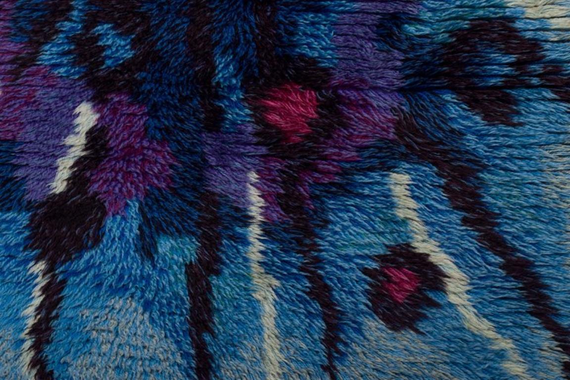 Swedish textile designer. Handmade rya carpet of pure cotton. Blue and violet colors.
Retro style.
1960s/70s.
Perfect condition.
Dimensions: 170 cm x 98 cm.