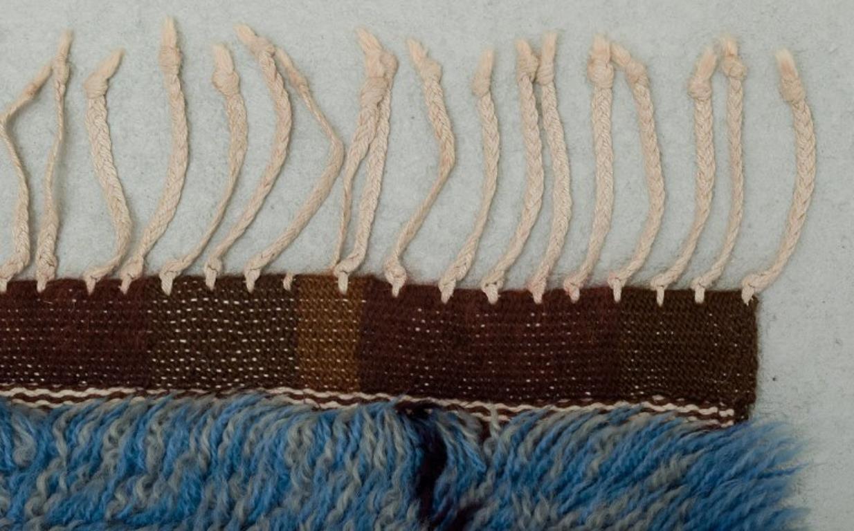 Mid-20th Century Swedish textile designer. Rya carpet of pure cotton. Blue and violet colors.