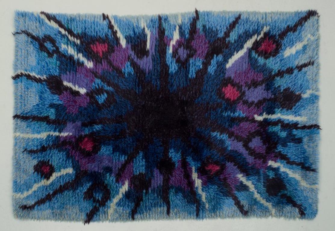 Cotton Swedish textile designer. Rya carpet of pure cotton. Blue and violet colors.