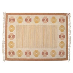 Swedish textile designer. Wool rug with geometric pattern. Rölakan technique.