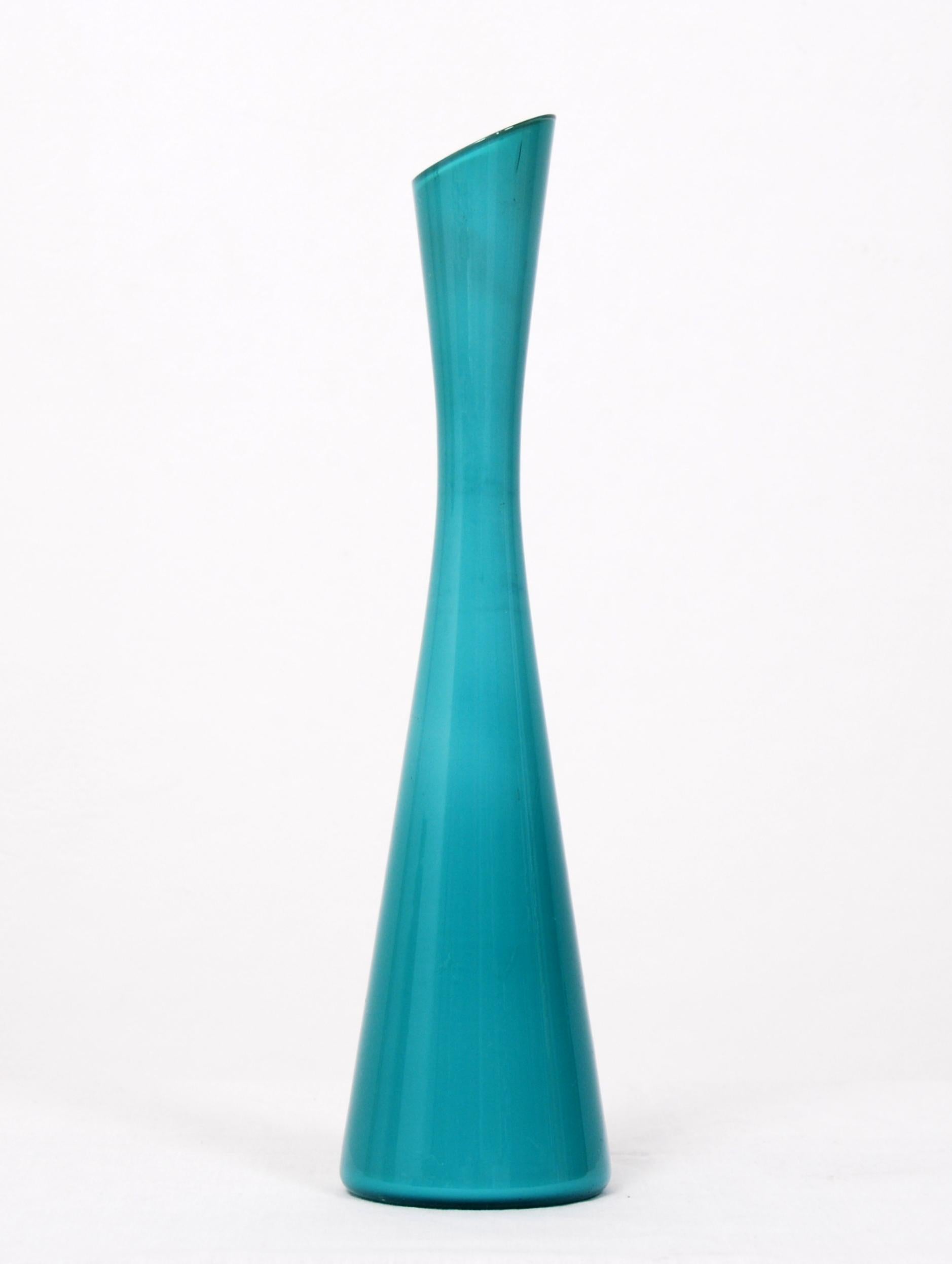 Turquoise glass vase with an opaline glass inside designed by Gunnar Ander in the 1960s for Elme Glasbruk in Sweden. 
 