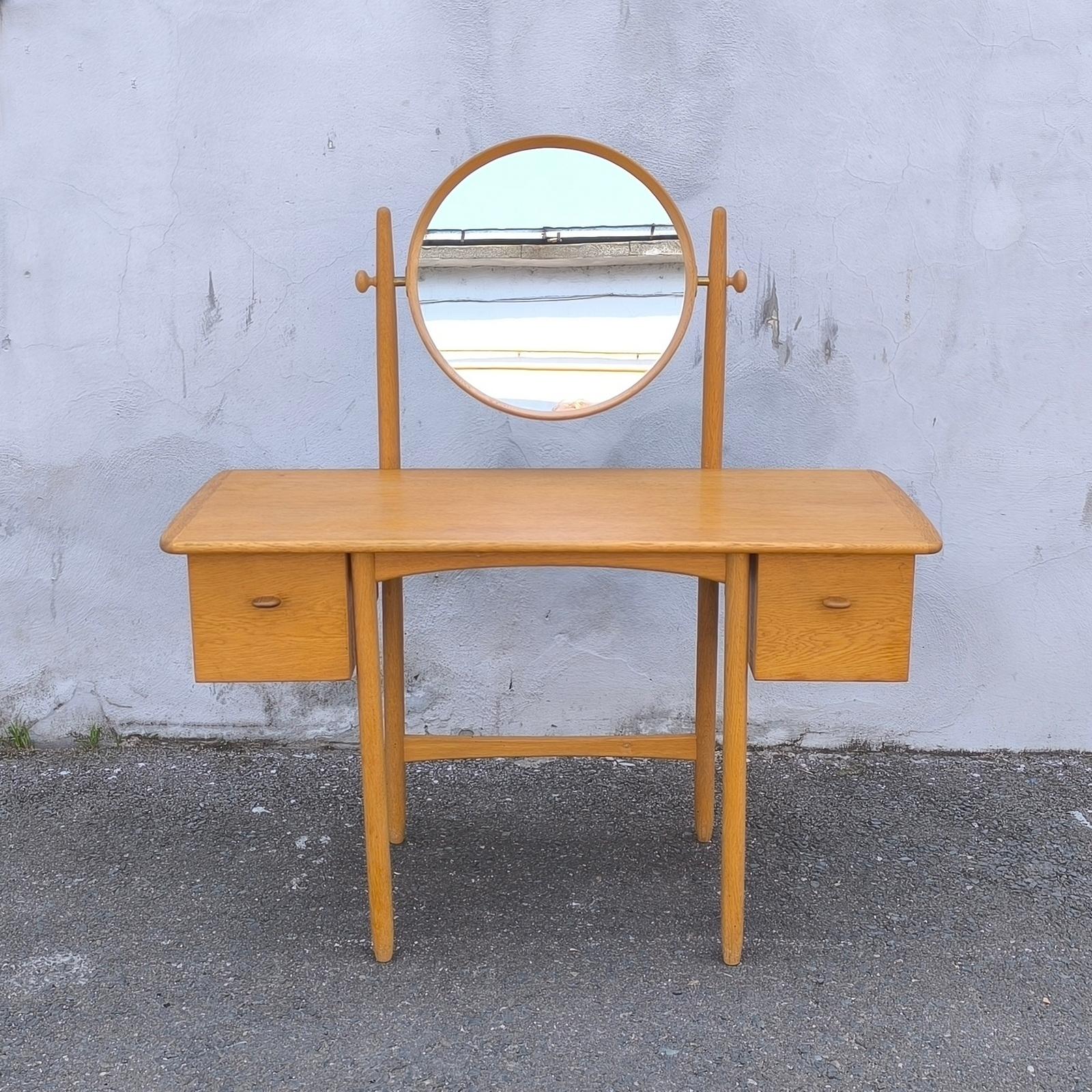 Rare and collectible Scandinavian Modern oak dressing table designed by renowned Swedish designers Sven Engström & Gunnar Myrstrand. Crafted in solid oak and produced by Bodafors in 1964, this striking mid-century vanity table* reflects minimalist