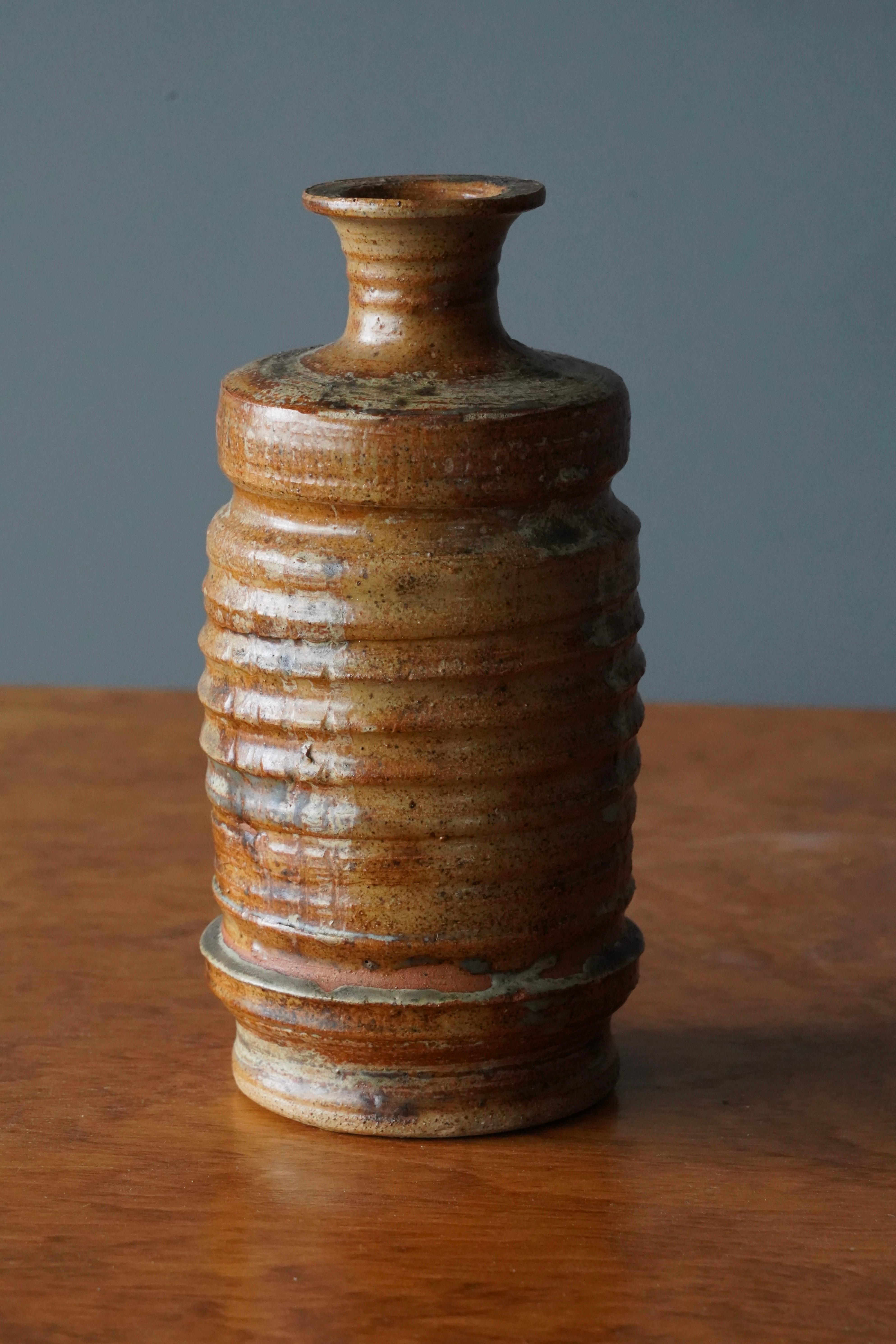 A vase, designed and produced in Sweden, 1950s. In incised and glazed stoneware.