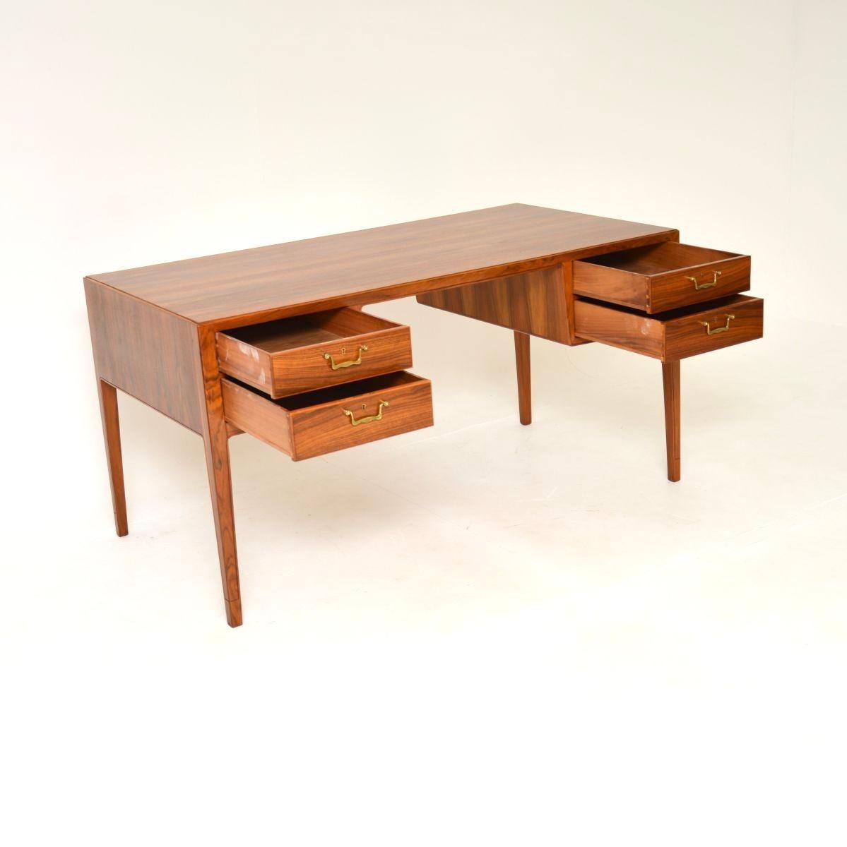 A stunning and extremely well made Swedish vintage walnut desk. This was recently imported from Sweden, it dates from the 1960’s.

The quality is exceptional, this is beautifully constructed and its a great size. It is made from walnut which has a