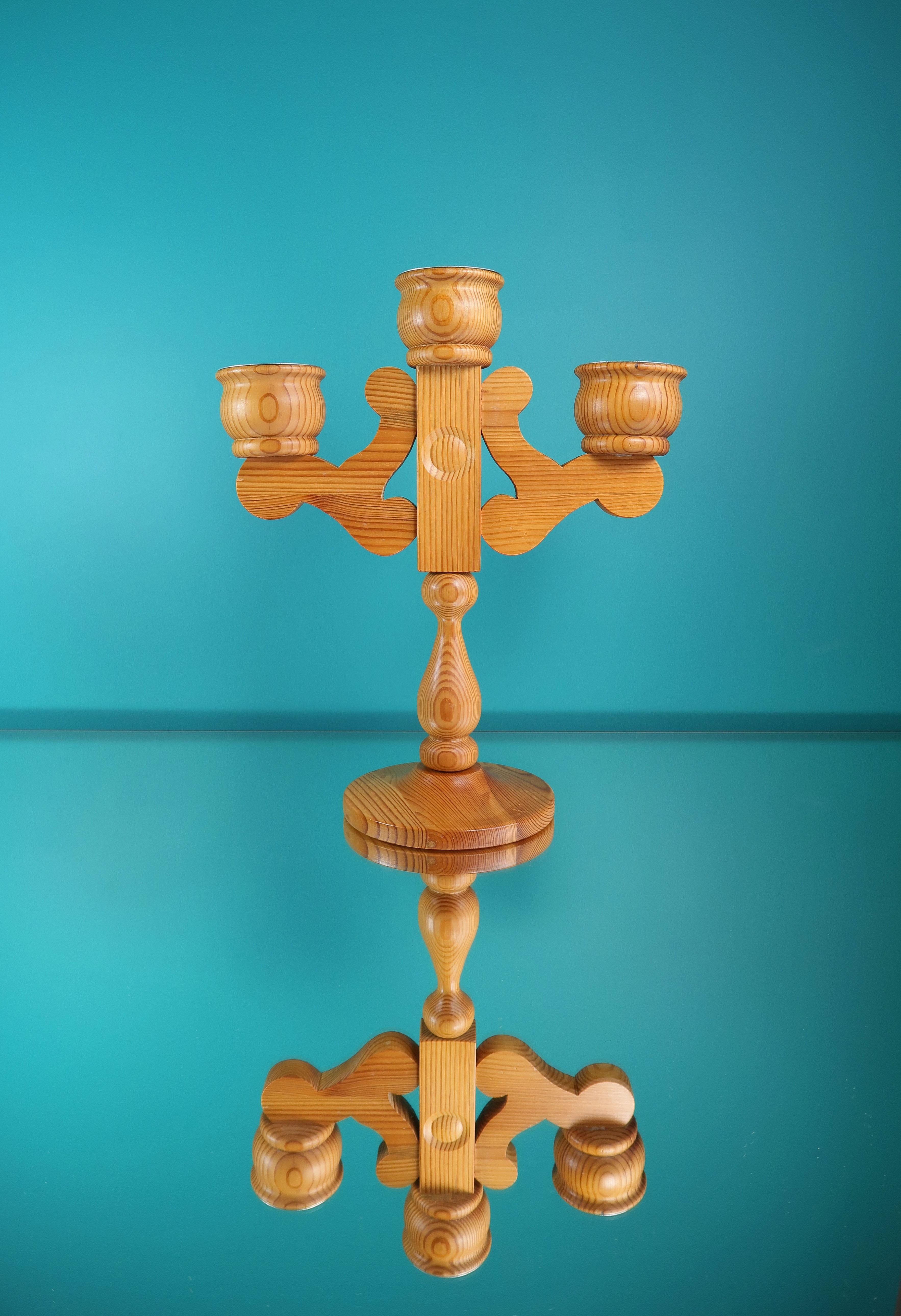 Large Swedish midcentury modern solid pine wood candelabra. Designed by Stig Johnsson and manufactured in the 1960s by Smålandsslöjd in the small Swedish town of Värnamo. Handmade with rounded organic shapes and three arms fitted for both slender