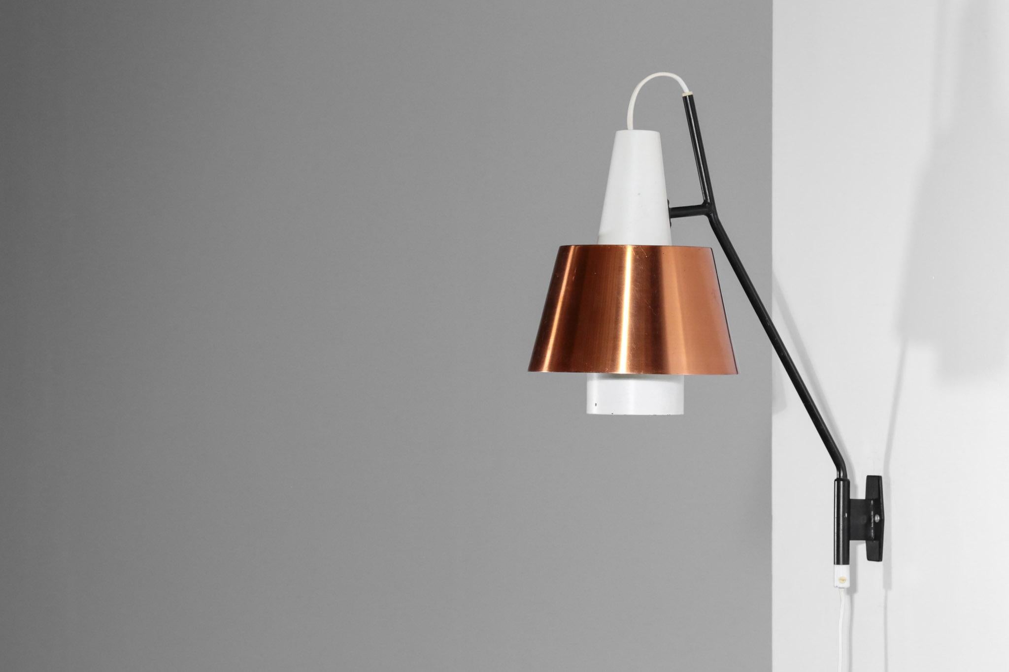 Swedish wall light from 1960s edited by Luco. Structure in steel with copper shade.