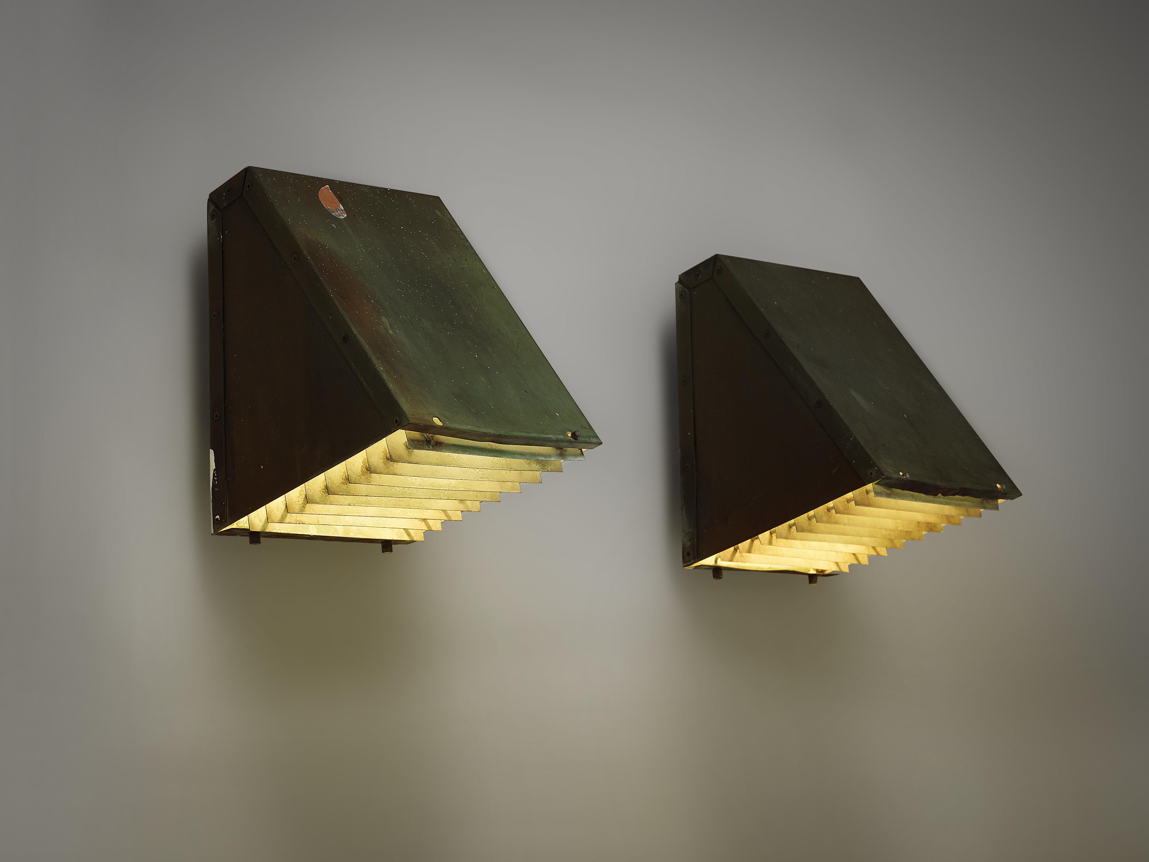 Wall lights, copper, Sweden, 1960s

These wall lights are executed in patinated copper. The light, that is reflected by the patinated copper creates a beautiful atmosphere. The straight shape of the lamps, create a sleek design. These lights owe