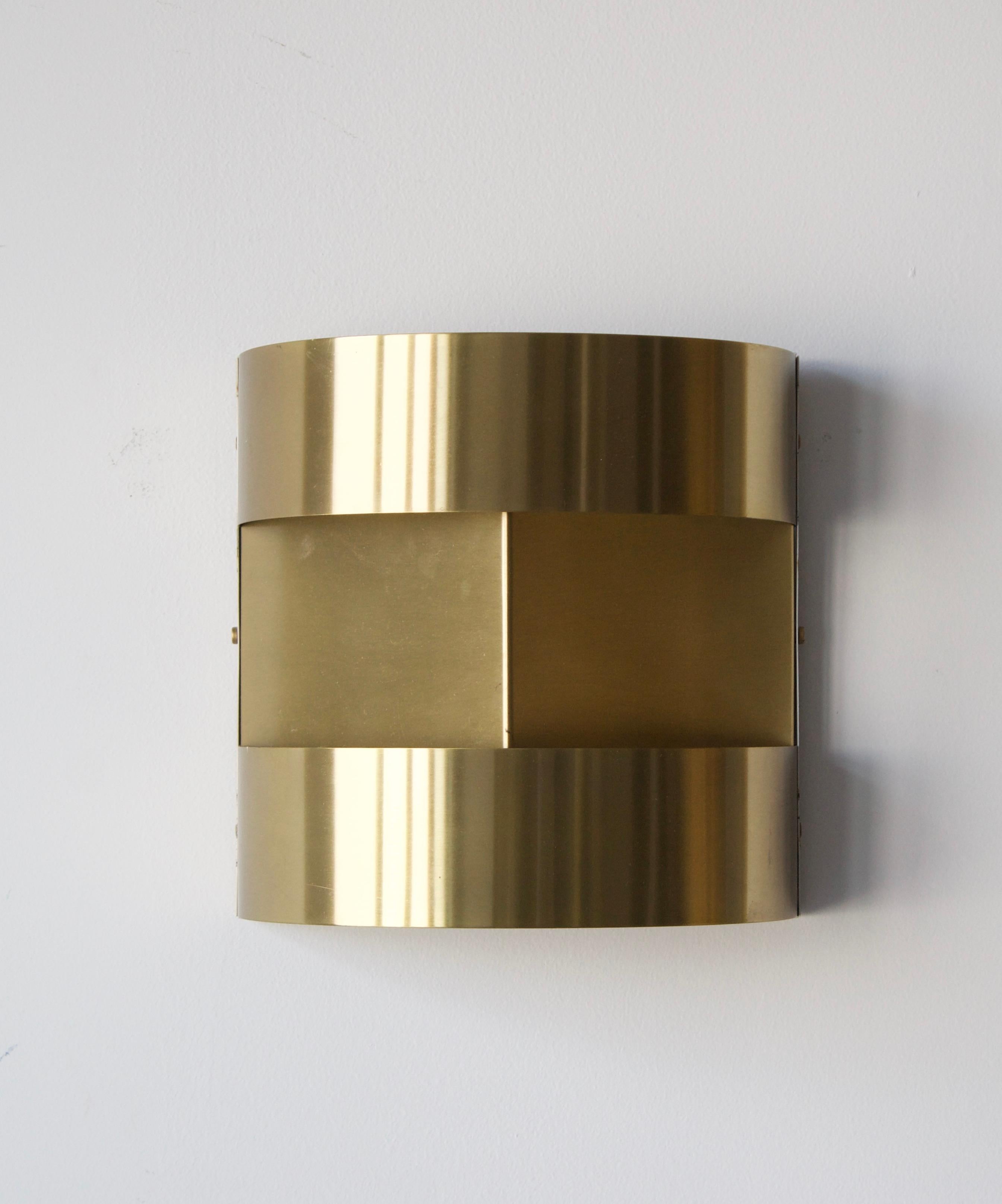 A pair of wall lights, designed and produced in Sweden, 1970s. In brass. 

Each fixture takes on lightbulb on standard medium base. No stated max wattage on fixture, not UL-listed.


 