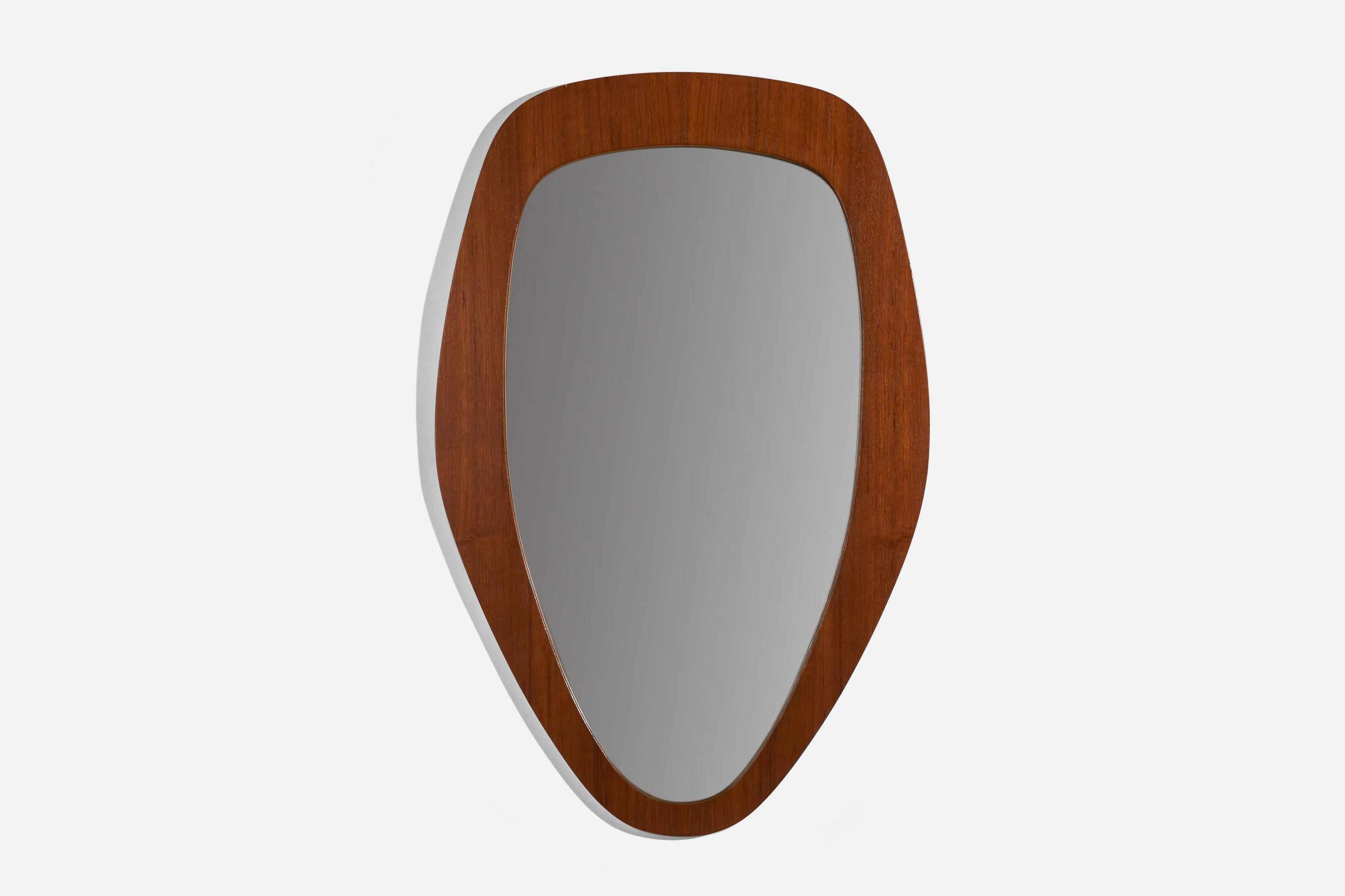 A teak wall mirror designed and produced in Sweden, 1950s.

 