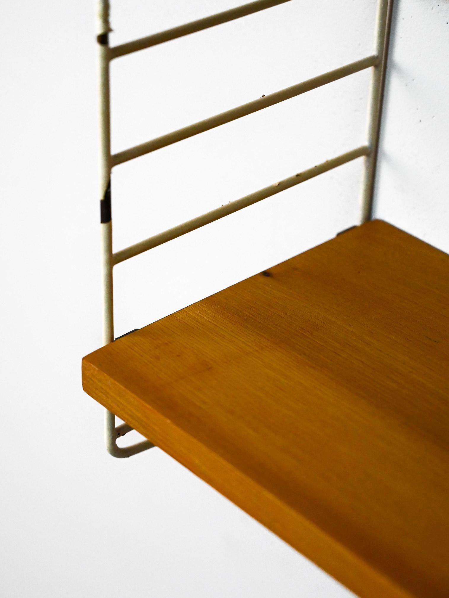 Swedish wall-mounted wood and metal bookcase 3