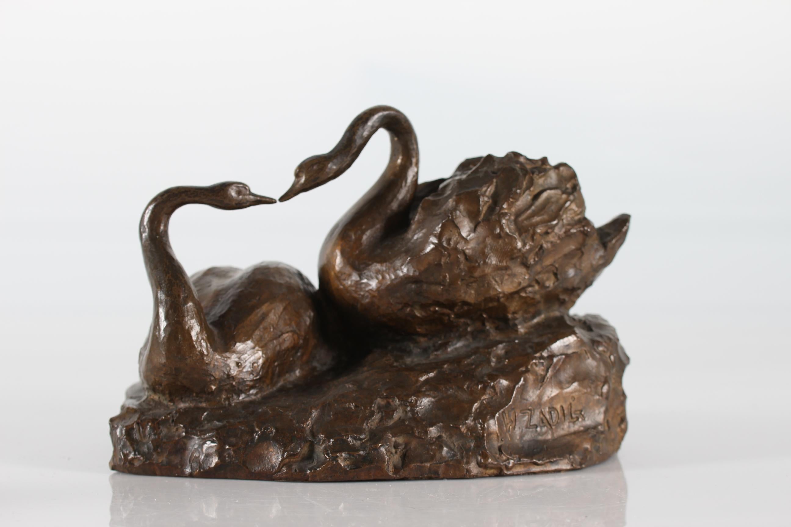 Bronze sculpture of a swan couple by the Swedish sculptor William Zadig (1884-1952)

Signed W. Zadig. Made in Scandinavia, 1930-1950

Very good vintage condition with beautiful patina.
 
  