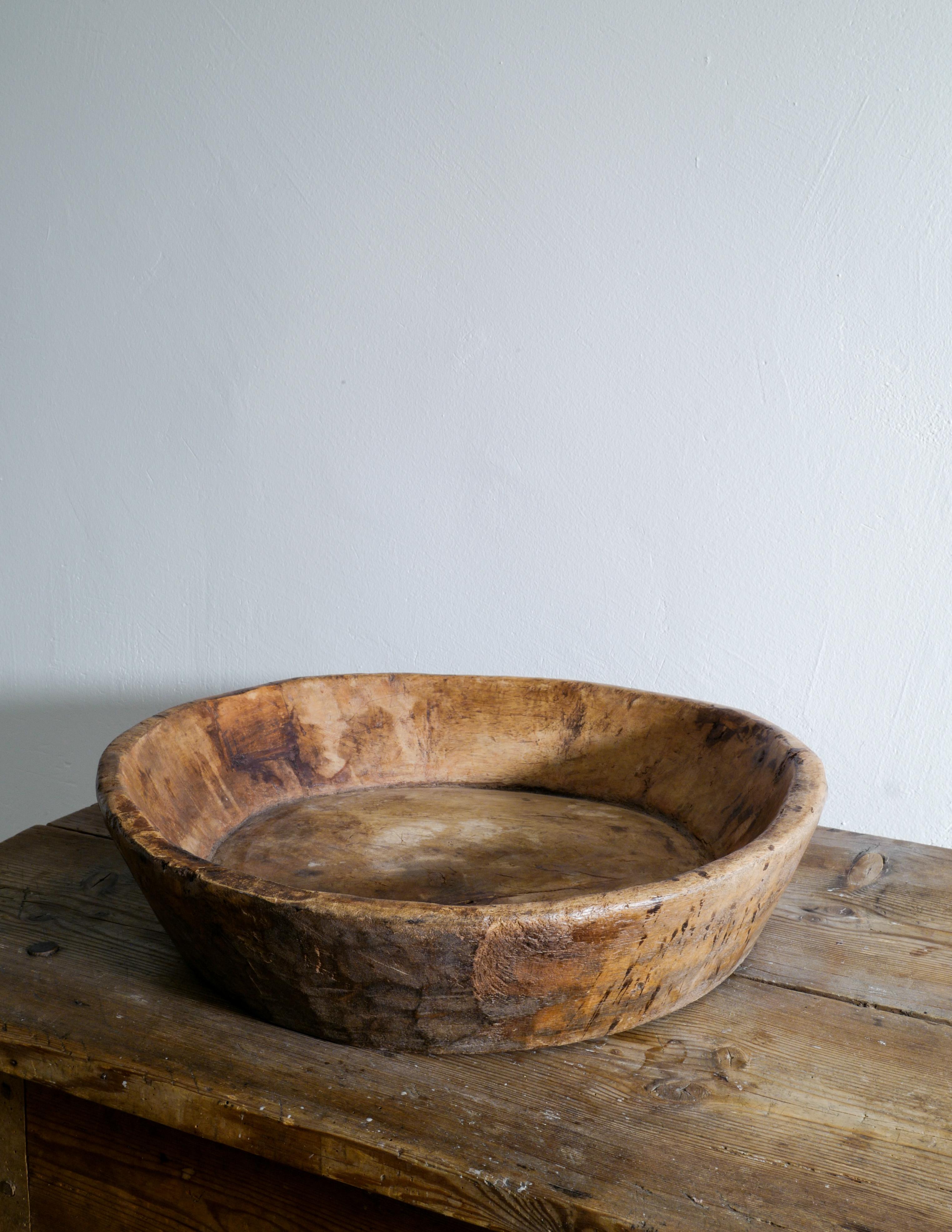 Rare and beautiful wooden bowl in a wabi sabi style produced in Sweden during the late 1800s. In good vintage condition showing nice patina from use and age.
