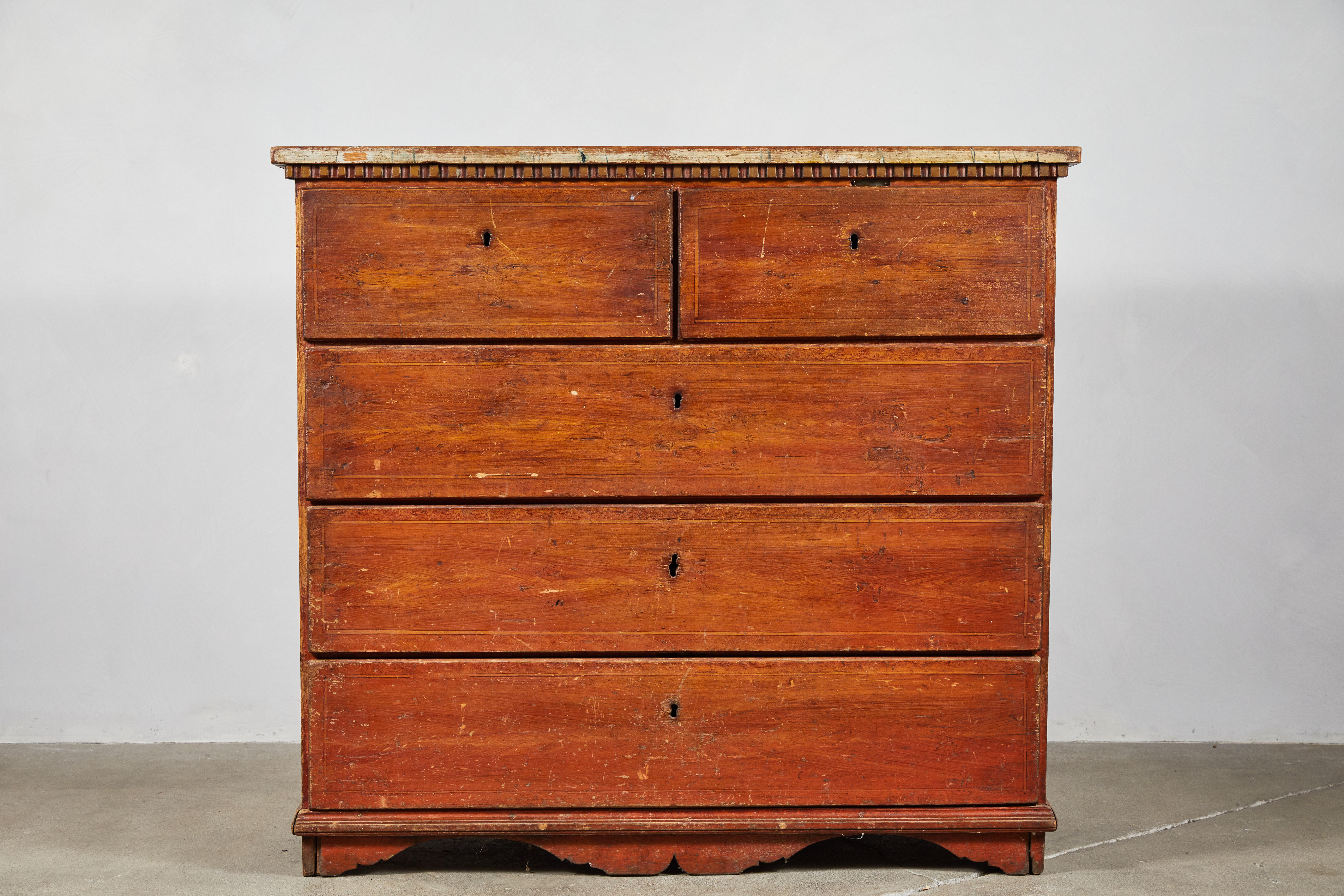 Swedish wooden five-drawer dresser with dental moulding. Dresser top has a beautiful faded washed patina.