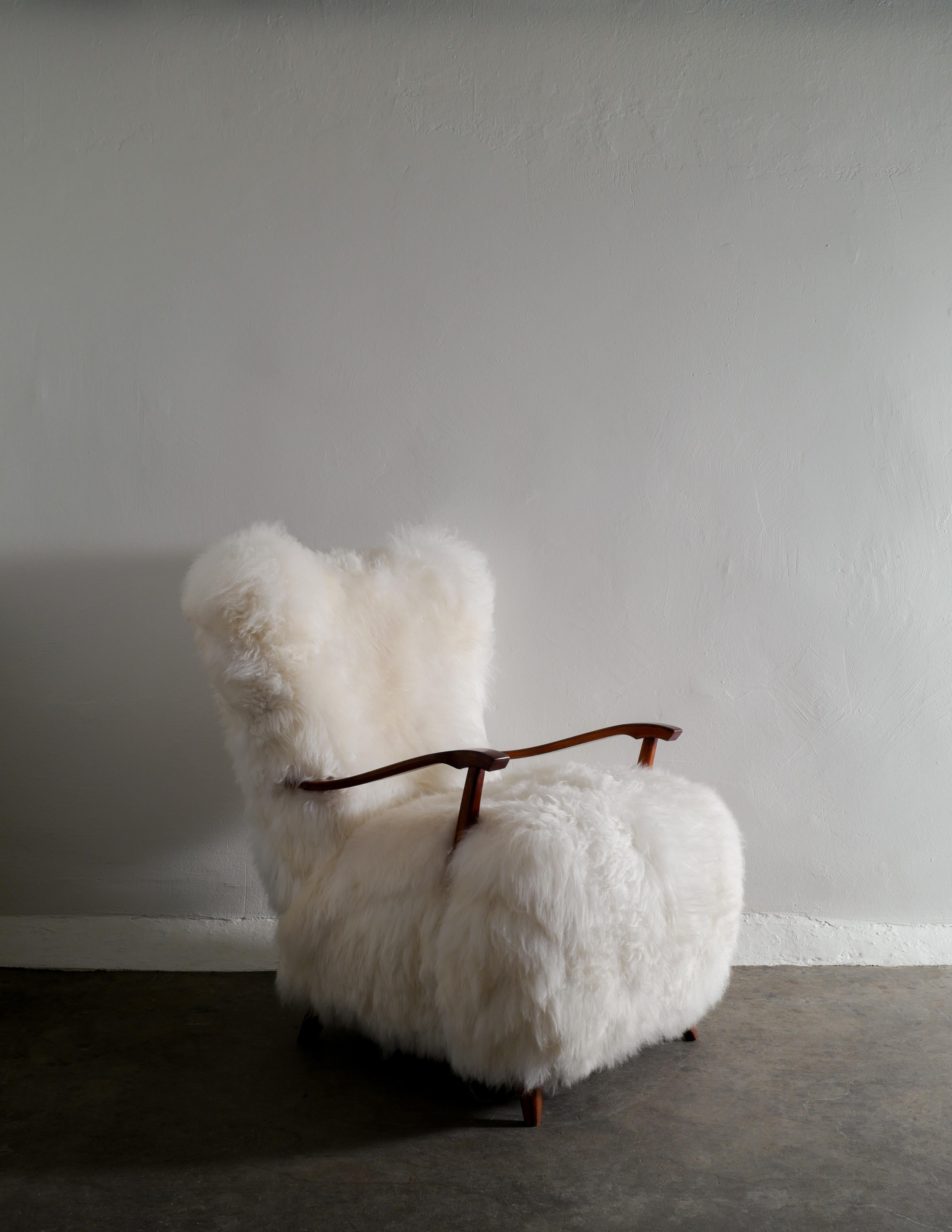 Swedish Wooden Mid Century Armchair with Sheepskin Produced in Sweden 1960s In Good Condition In Stockholm, SE