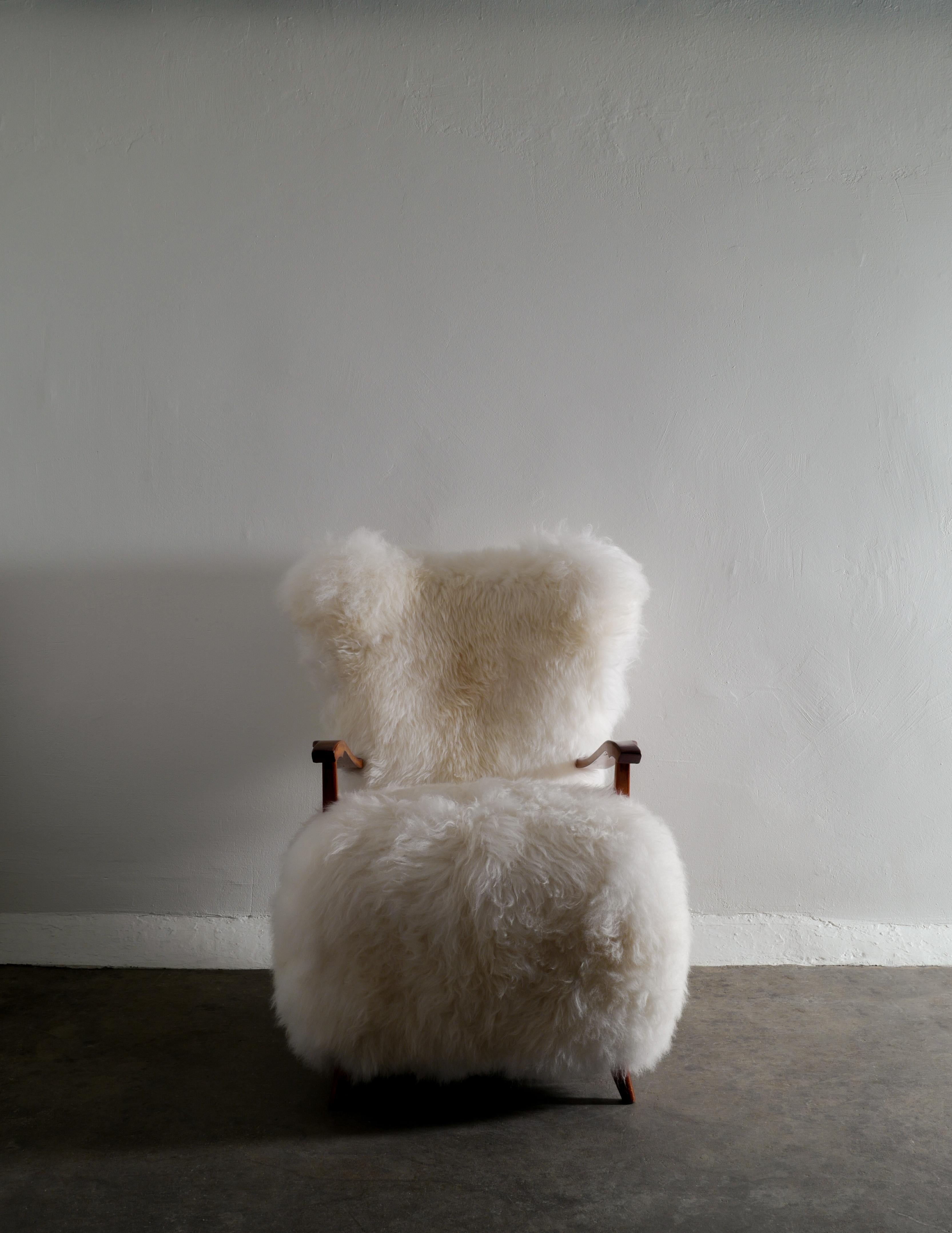 Swedish Wooden Mid Century Armchair with Sheepskin Produced in Sweden 1960s 1