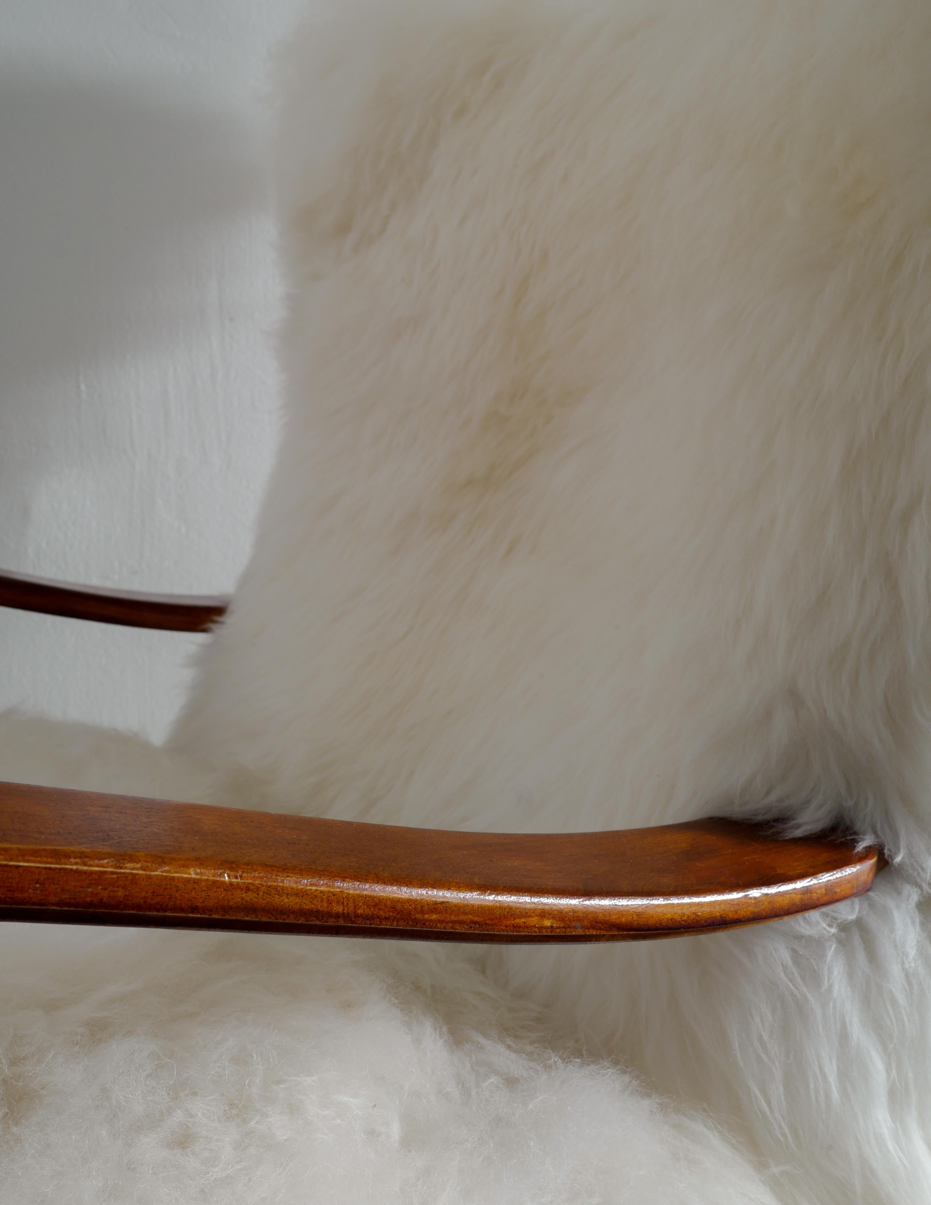 Swedish Wooden Mid Century Armchair with Sheepskin Produced in Sweden 1960s 2