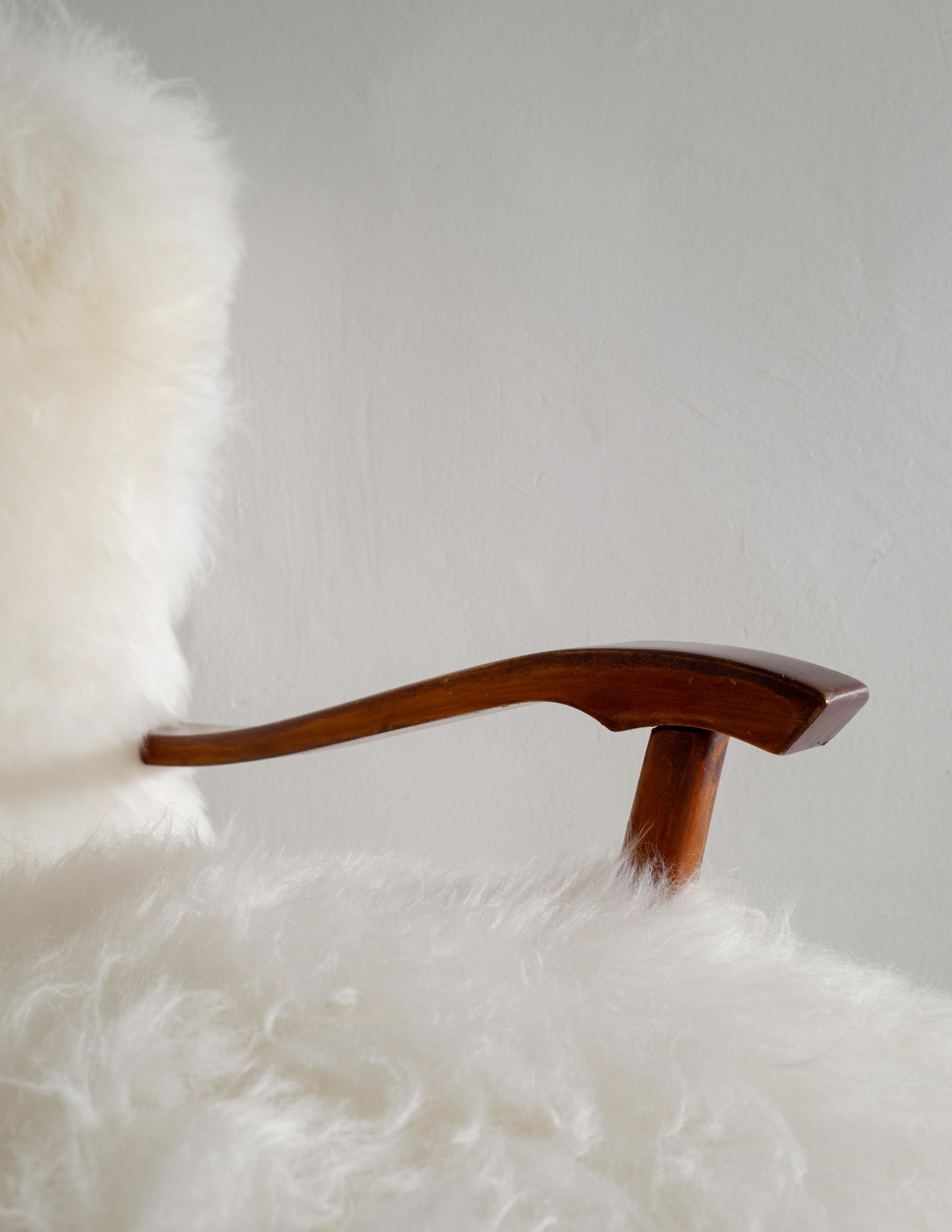 Swedish Wooden Mid Century Armchair with Sheepskin Produced in Sweden 1960s 4
