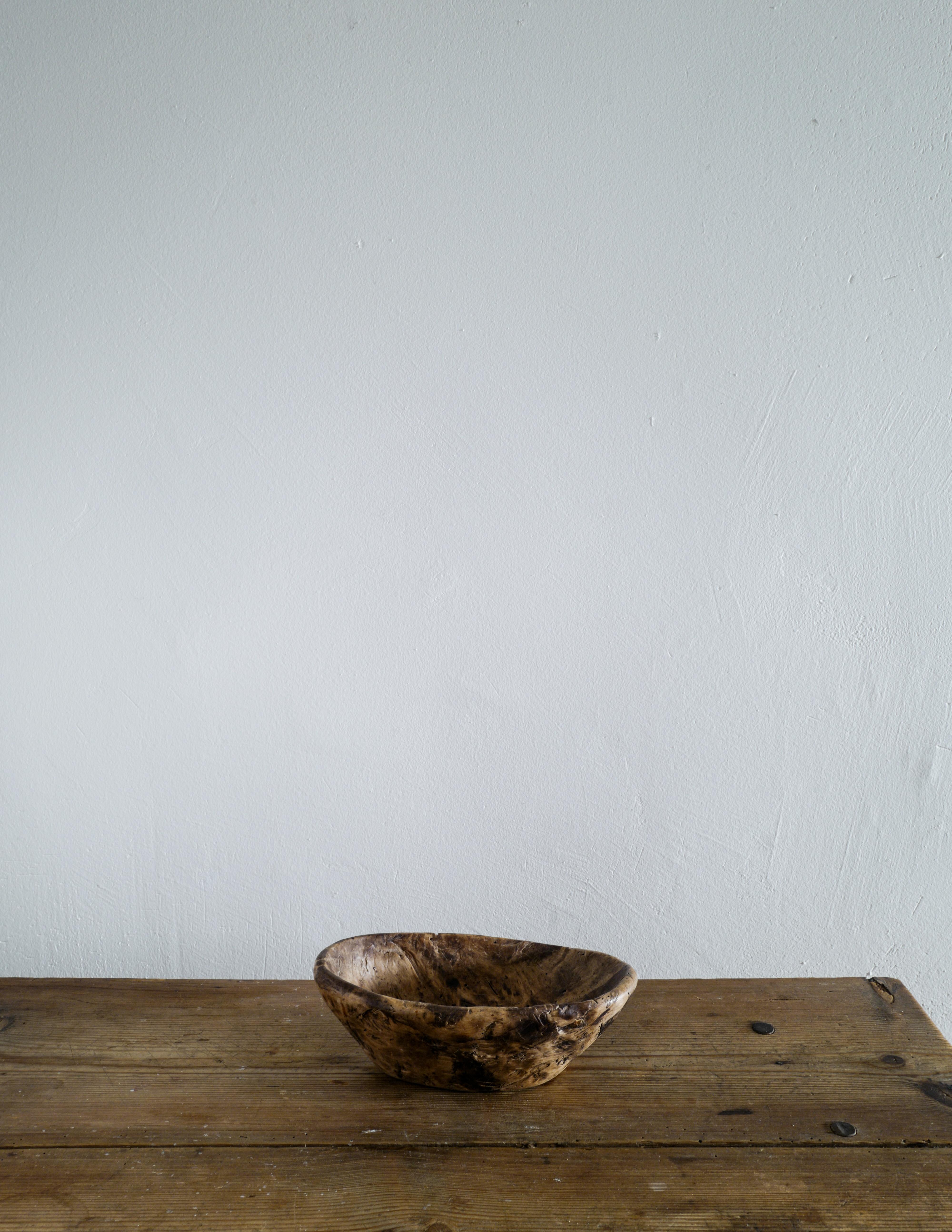 Rare and beautiful wooden bowl in a wabi sabi style produced in Sweden during the early 1800s. In good vintage condition showing nice patina from use and age.