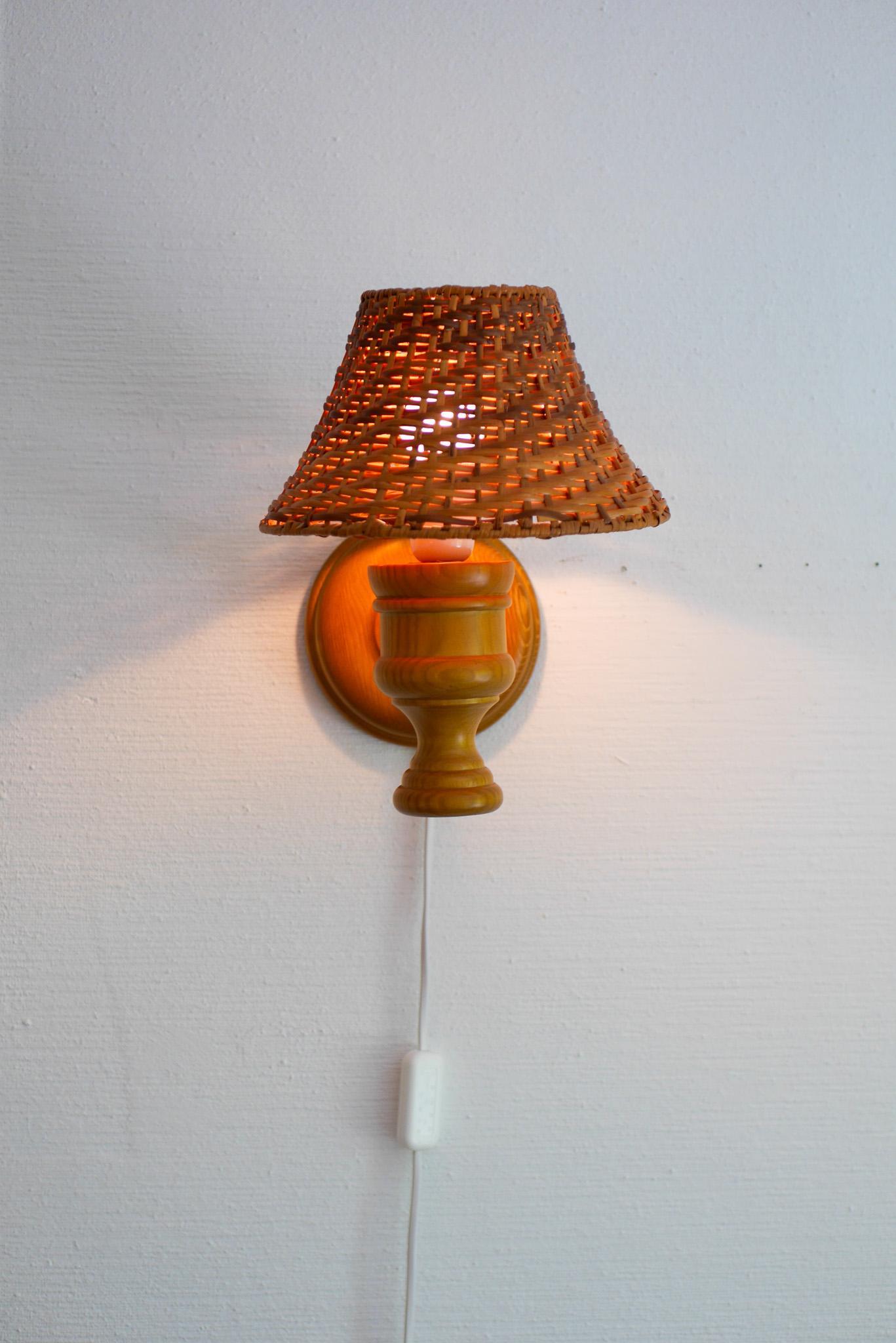 Swedish wooden sconce and rattan shade, a Wall Lamp by Smålandsslöjd Sweden For Sale 4