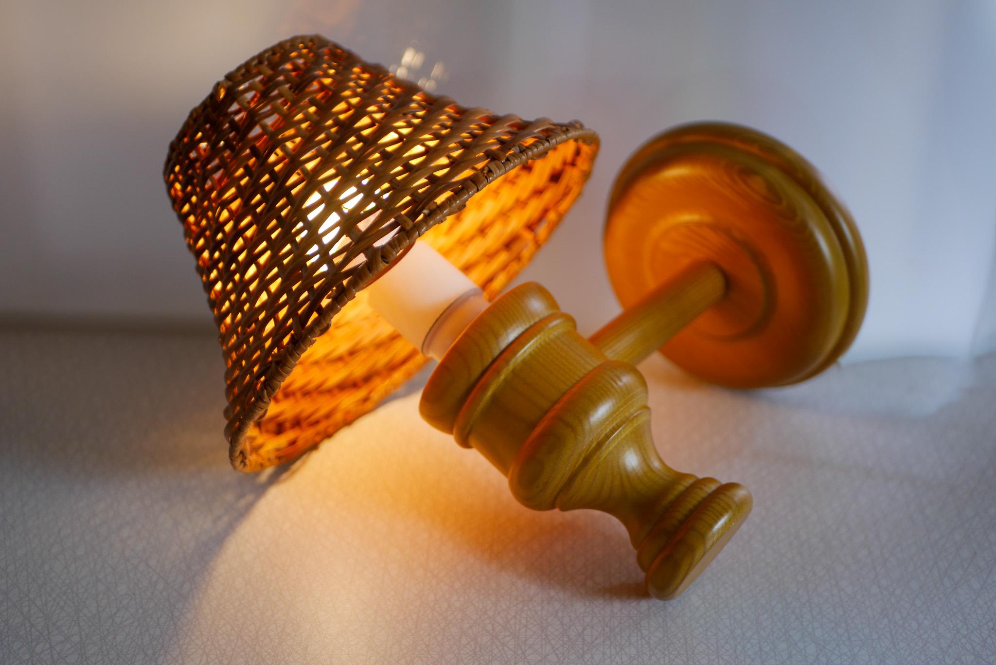 Swedish wooden sconce and rattan shade, a Wall Lamp by Smålandsslöjd Sweden In Good Condition For Sale In Skarpnäck, SE