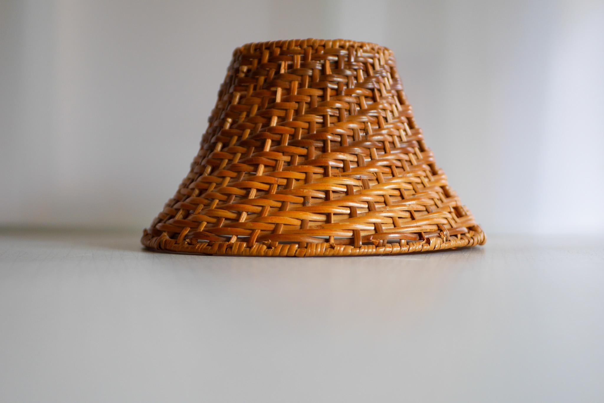 Late 20th Century Swedish wooden sconce and rattan shade, a Wall Lamp by Smålandsslöjd Sweden For Sale